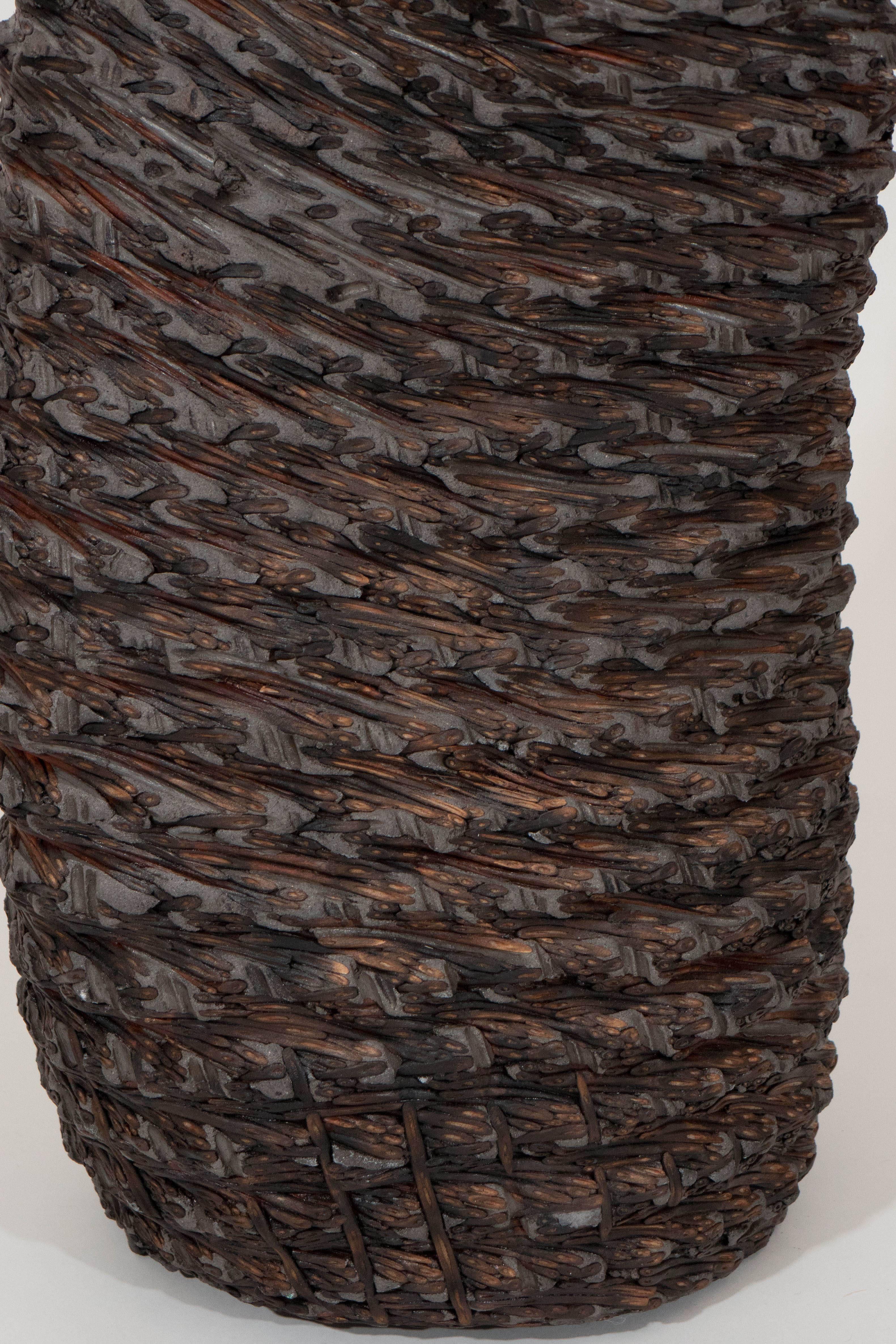 Trained as a basket maker in Germany during the 1980s, Klaus Titze combines technology and artisanal tradition with his concrete basket forms. Organically shaped wicker forms are made using a special twisting technique and brushed with fiber mortar.