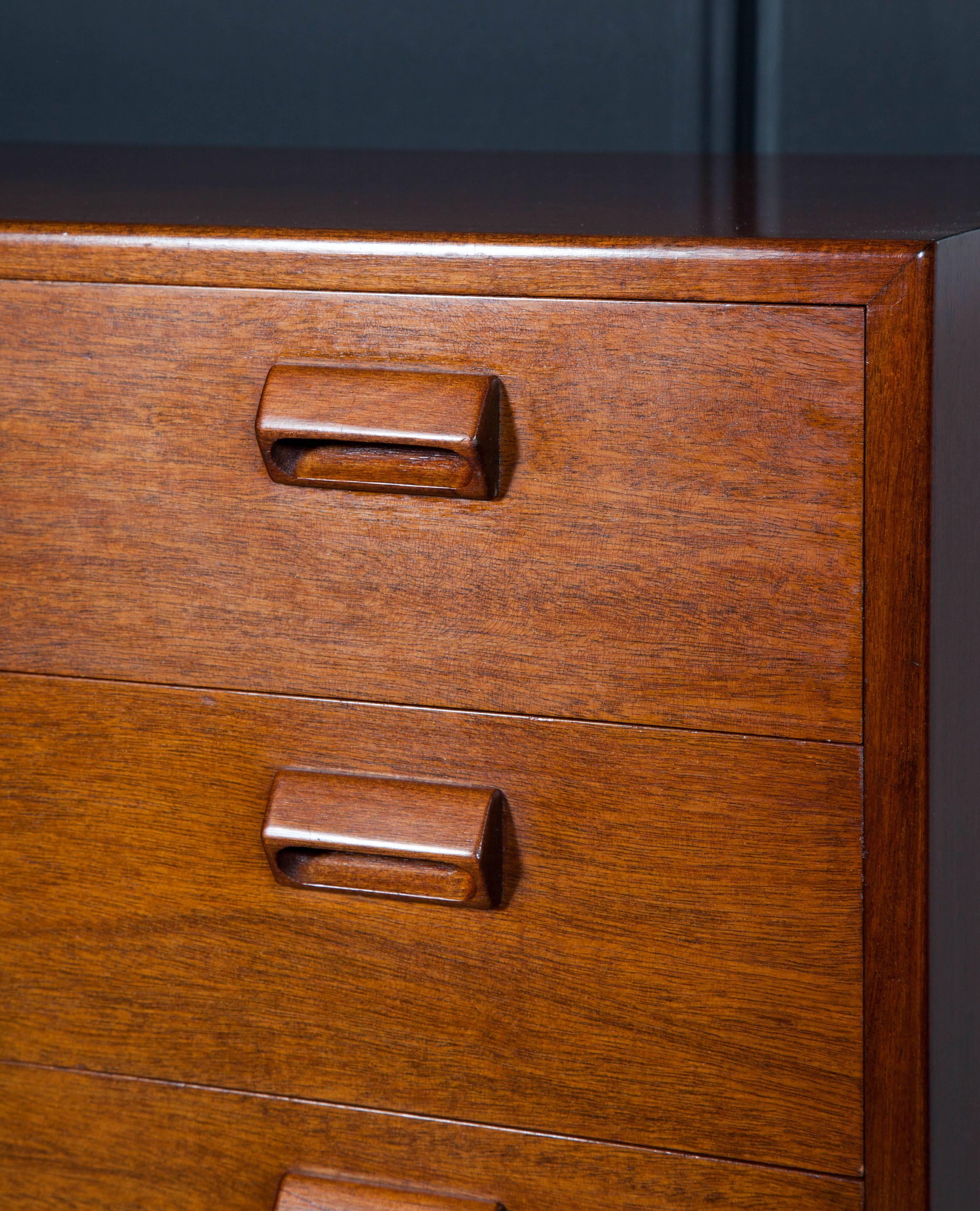 Vintage 1950s Highboy Dresser from Denmark

This Danish Dresser is the largest chest of drawers to come out of Denmark. Beautifully built and designed by Borge Mogensen. The oak base and teak body was very popular for the time, but the oak is not