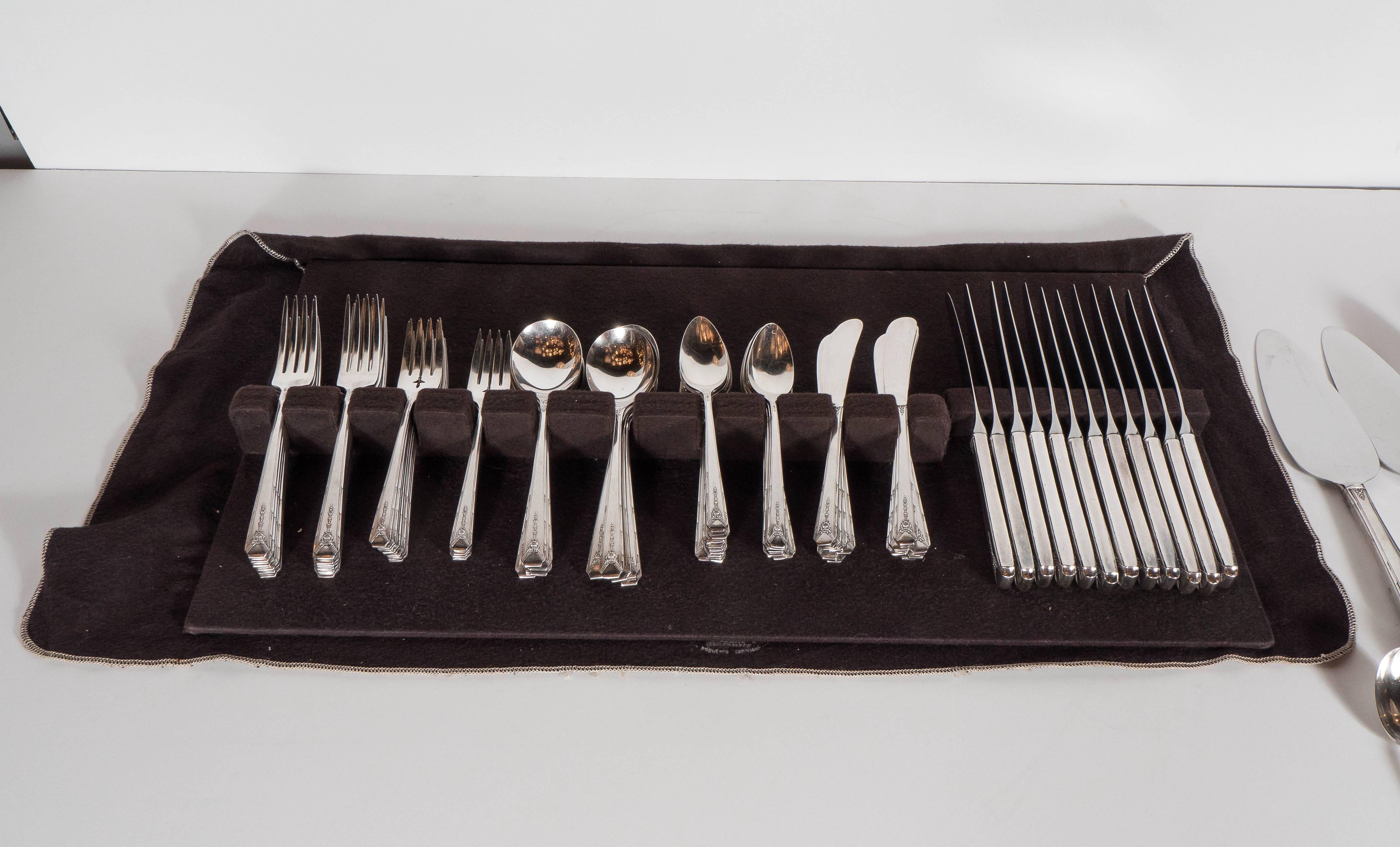 This complete service for 12 of silver plate flatware features a stylized Art Deco geometric and floral detailing. It has 12 dinner knifes, 12 dinner forks, 12 salad forks, 12 soup spoons, 24 teaspoons, 12 butter knives. Also includes serving pieces