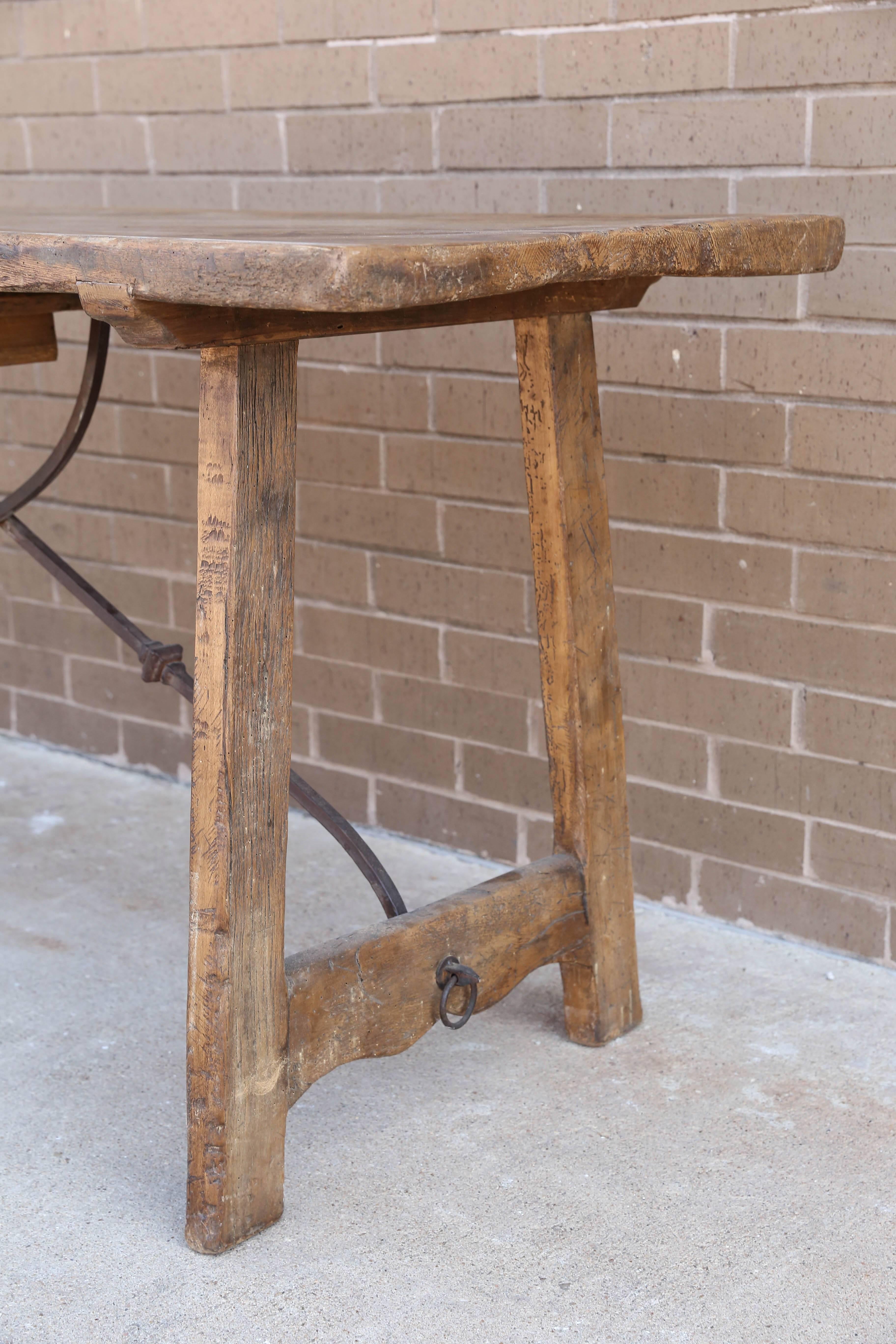 Featured is an adorable Italian desk or sofa table with walnut legs ,oak top and iron stretcher.  Size of the drawer is 9"w x 3.5 t. From the bottom of the drawer to floor is 26 ".