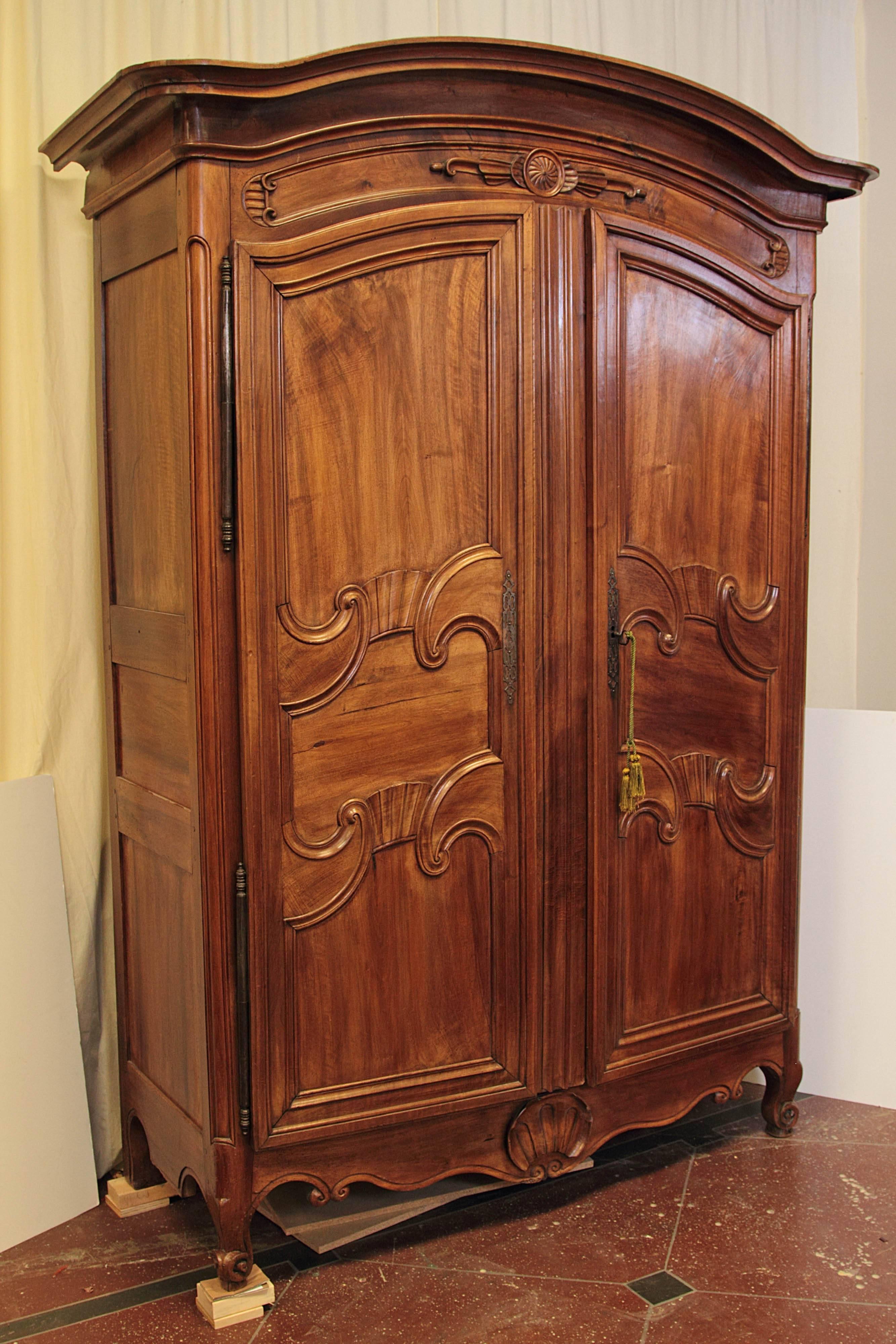 19th century French armoire. Curved feet and shell motif at bottom, circa 1840.