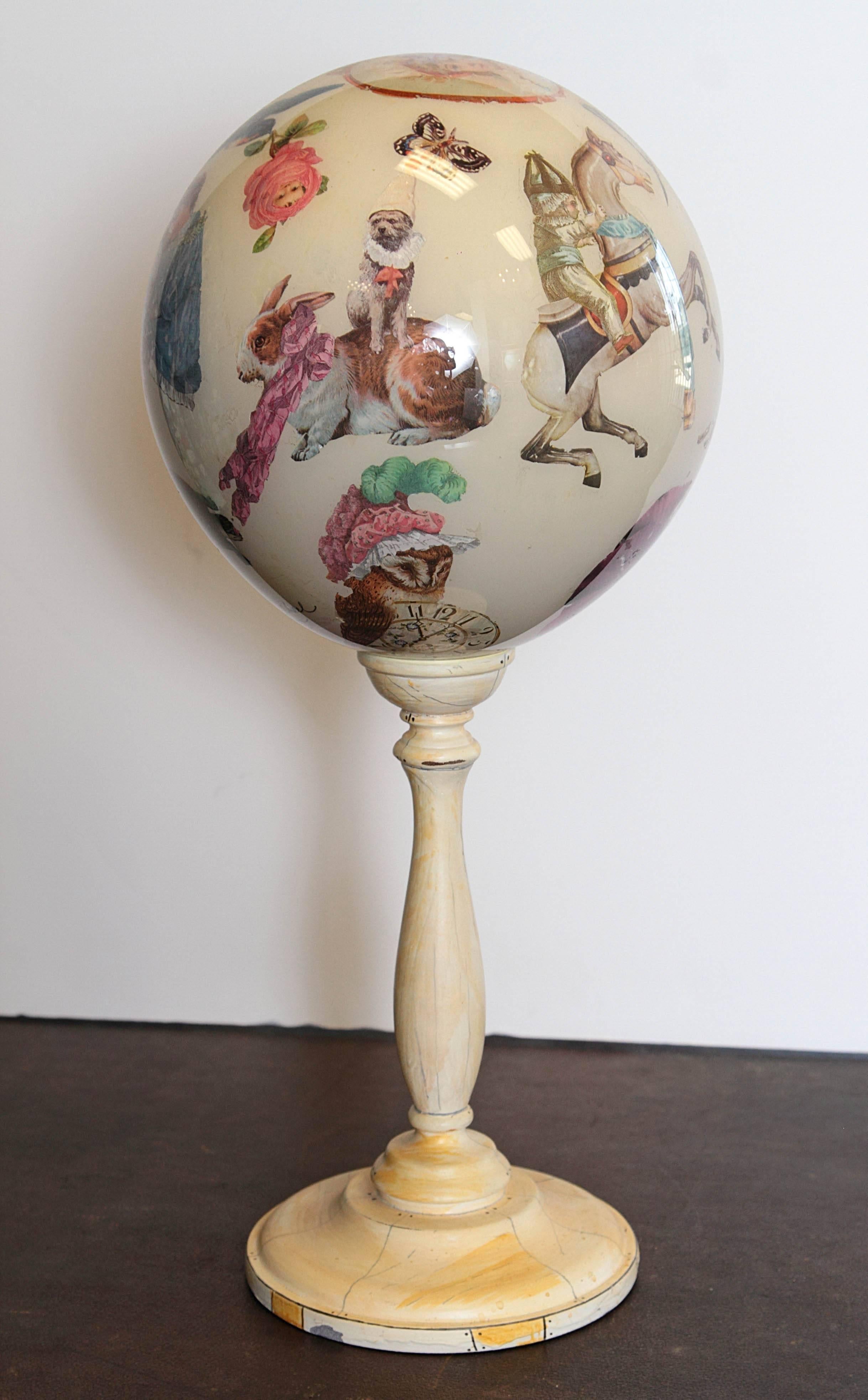 Reverse decoupage globe with painted turned wood Stand. Titled 