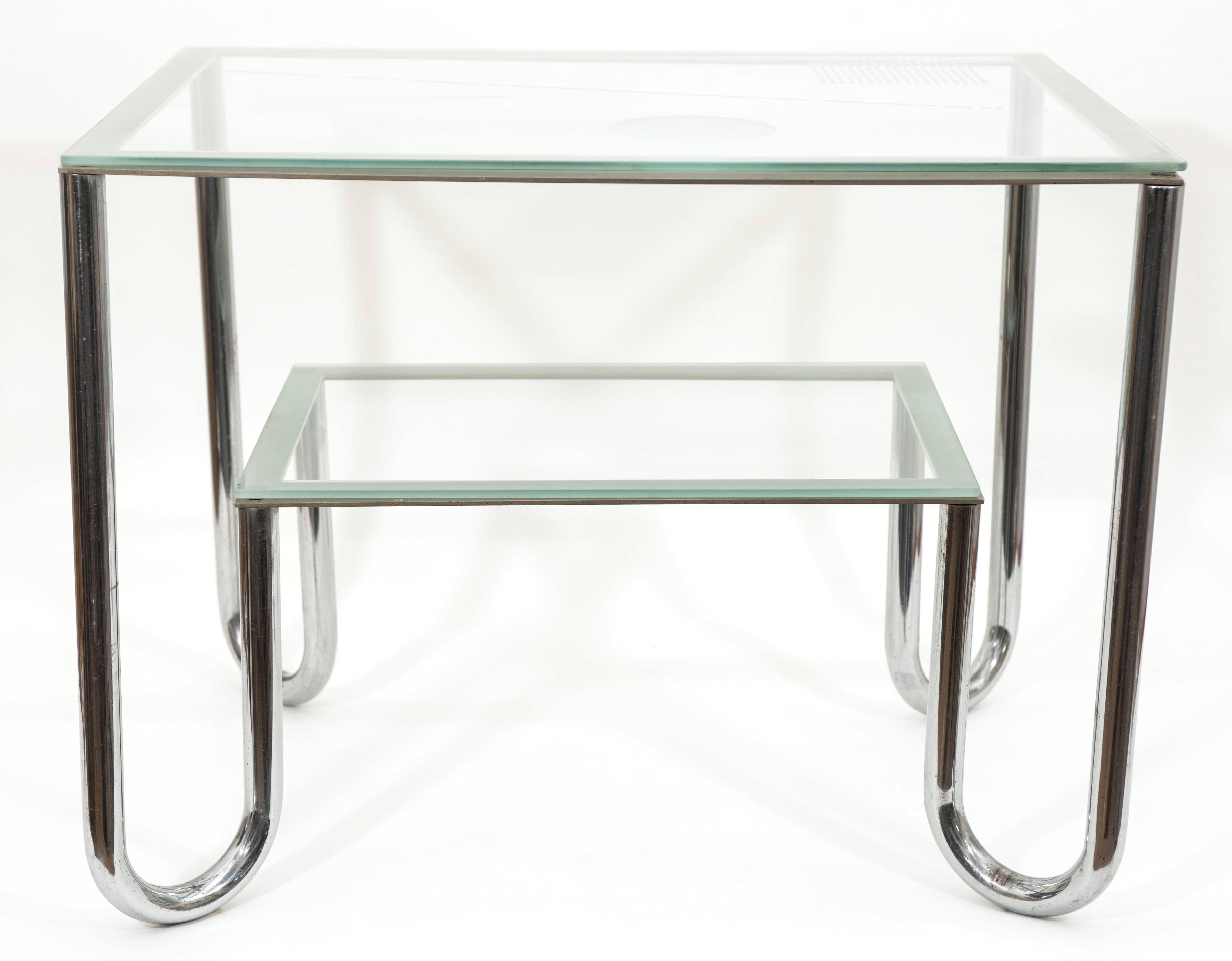 Rare Art Deco nickel-plated tube two level coffee table with sand blasted geometrical composition glass top.