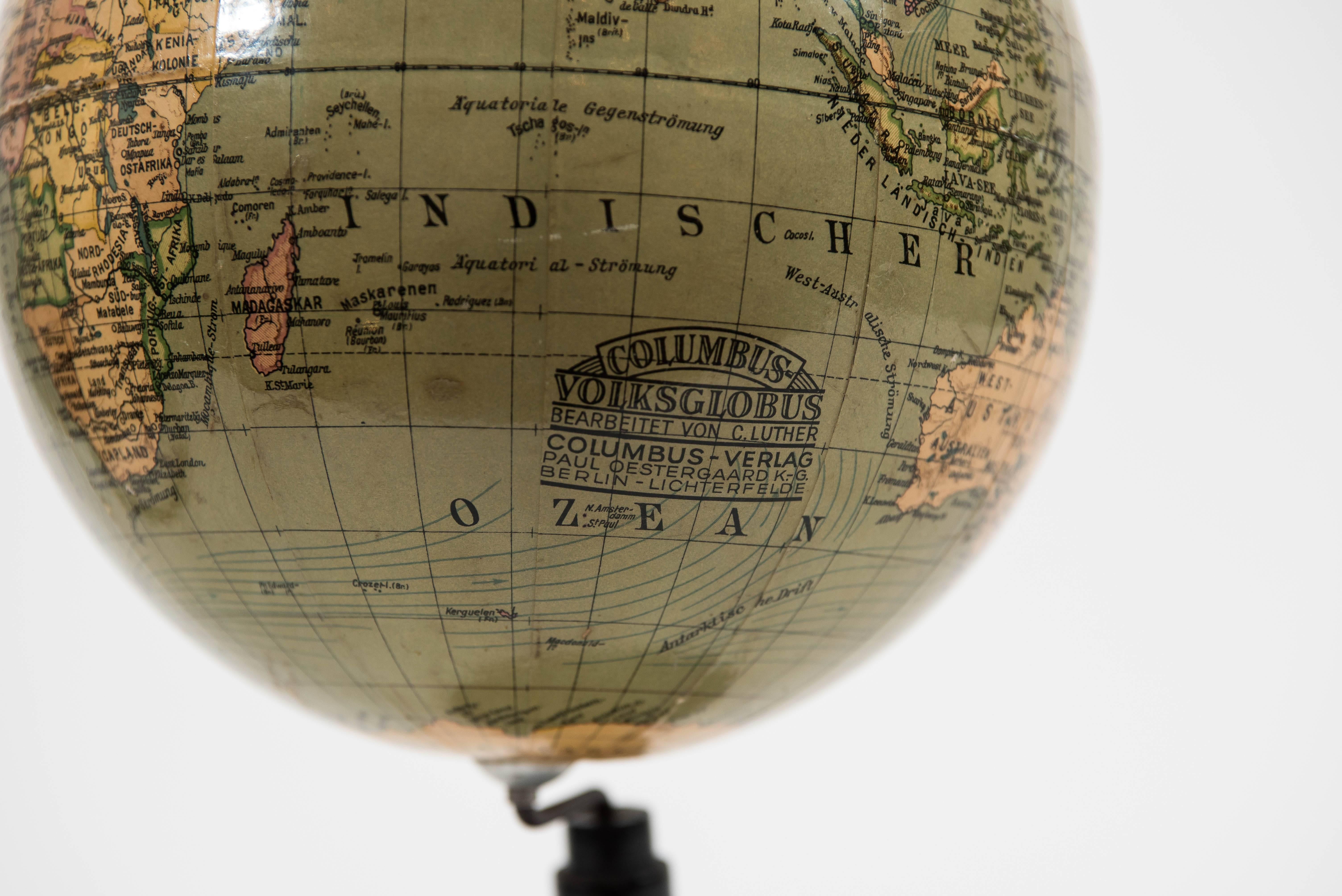 A nifty and petite terrestrial globe from the early 1930's with original ebonized polished wood base.