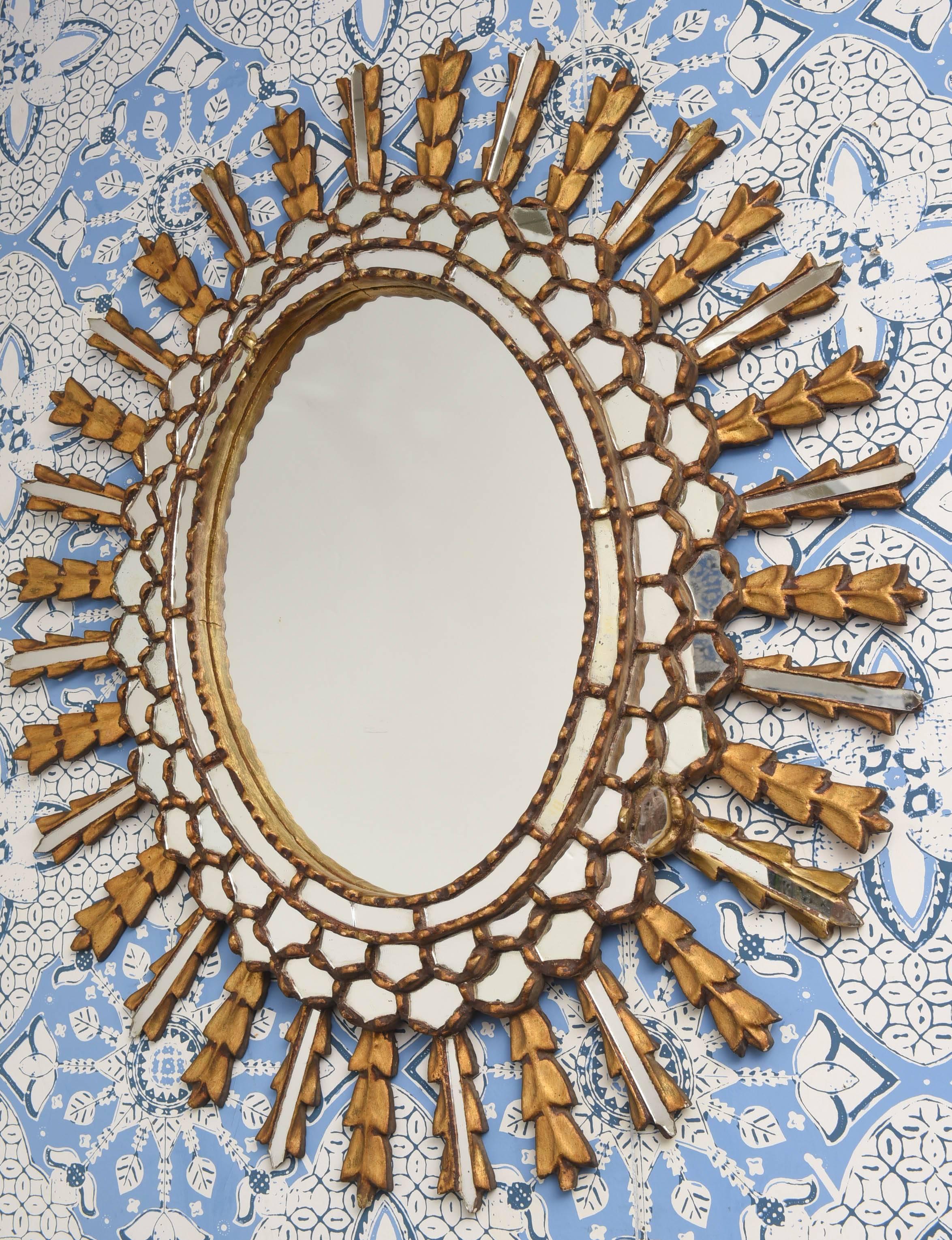 European gilt mirror with plenty of mirrors and details.