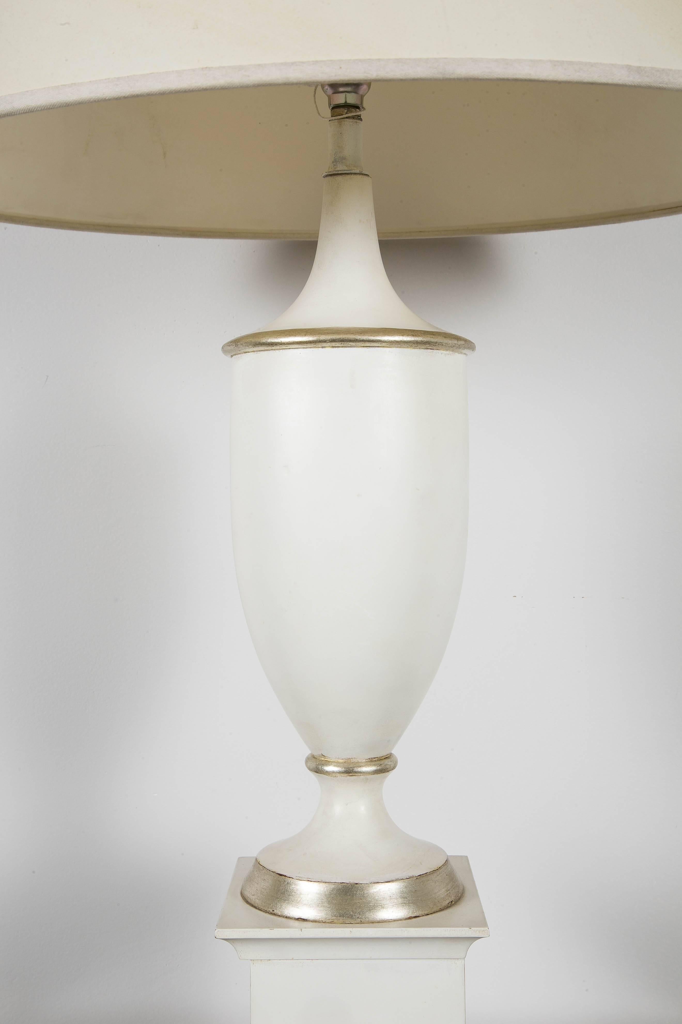 A Pair of Amphora shaped lamps .
 White lacquered wood with silver details .
France
Circa 1950