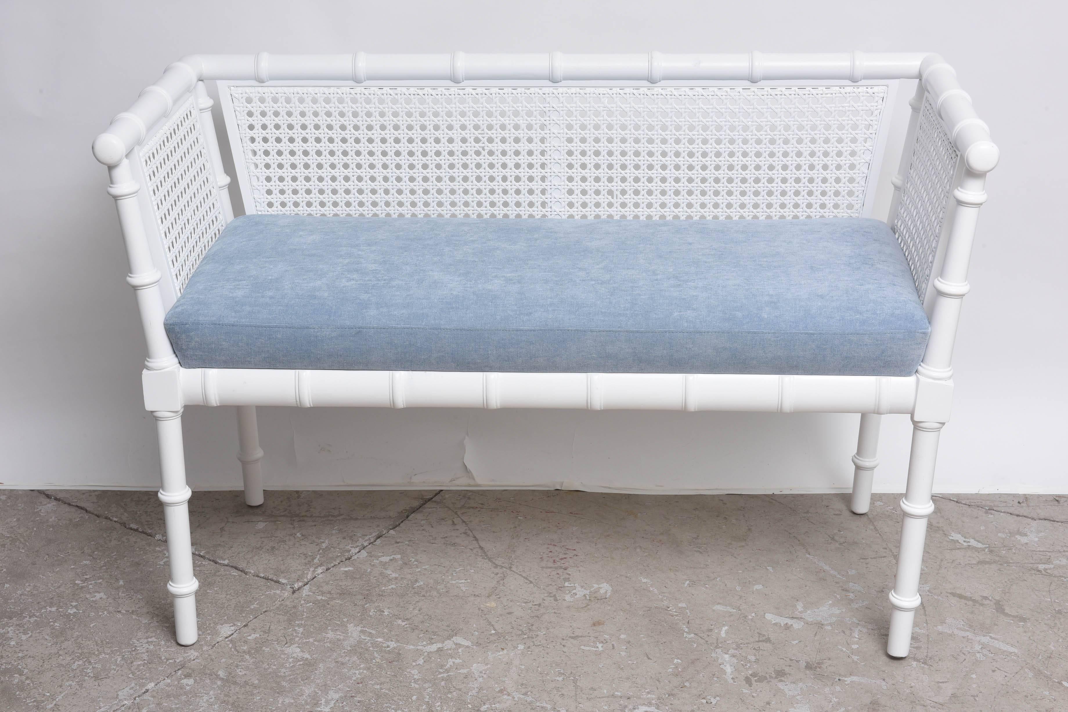 Upholstered foam on wood construction, frame done in a faux bamboo style.
Finished in a satin white paint. A great addition to modern, contemporary, or Classic interior.
