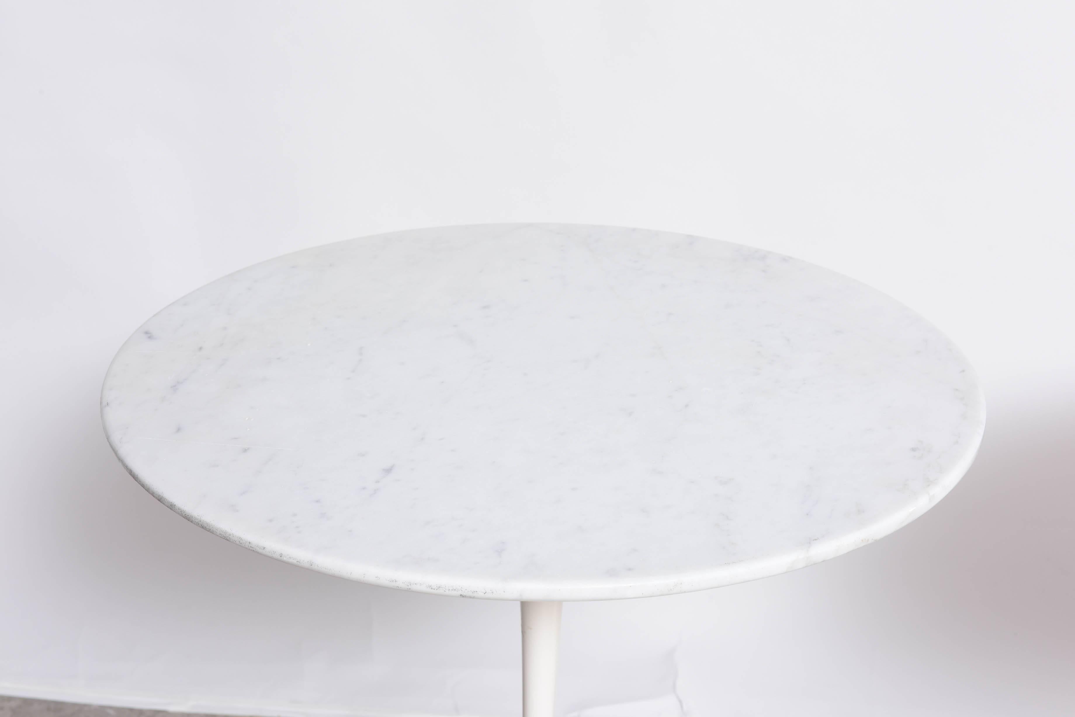 A Classic pair of Eero Saarinen tulip side tables. These are Vintage and have normal use, the bases have been professionally re-finished, the bases are the vintage ones that are heavy, not like the new production. A great addition to modern or