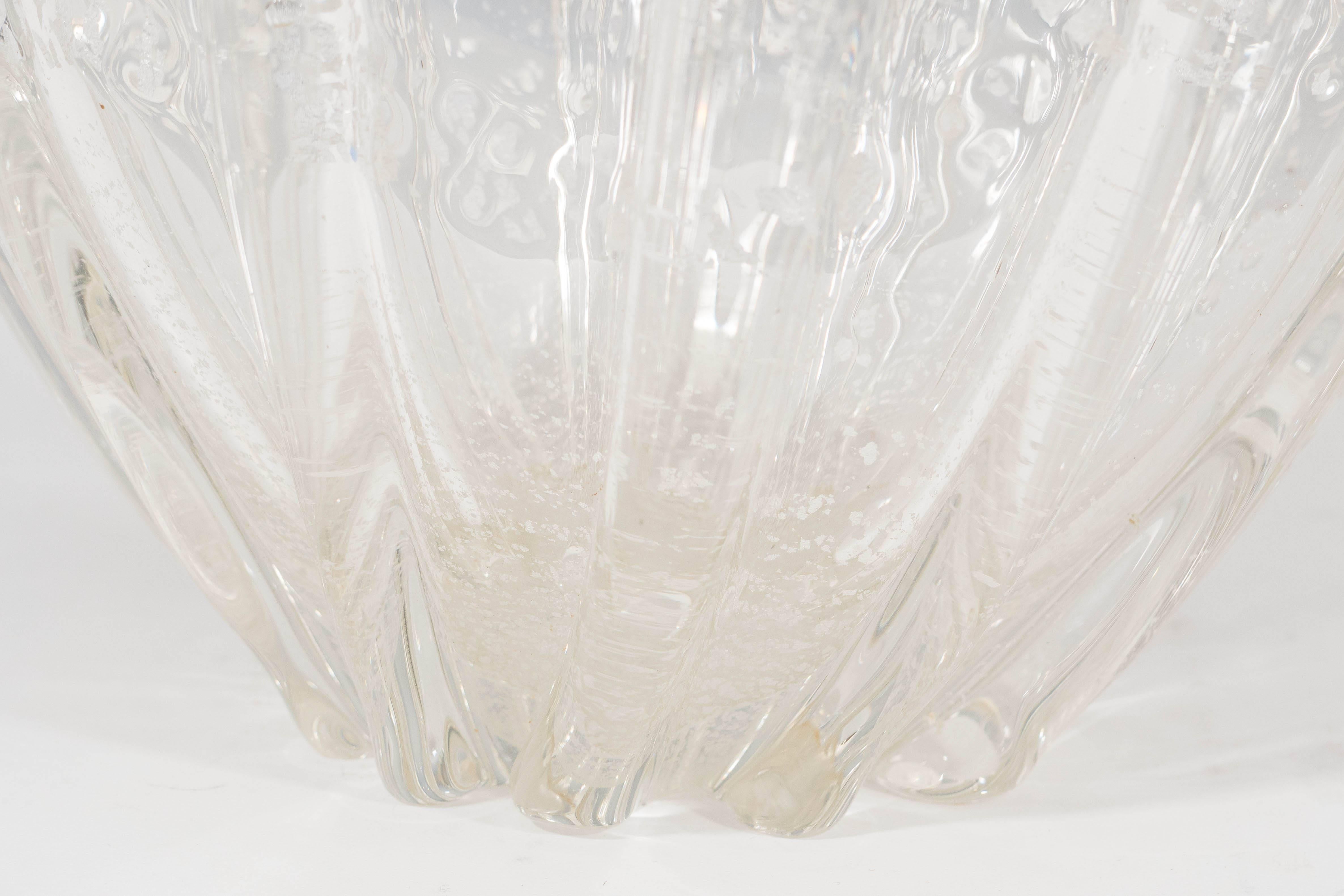 A large Murano glass 'pillow' vase, produced circa 1950s by Archimede Seguso, the gently ribbed body infused with flecks of 14-karat white gold. Very good vintage condition, consistent with age.