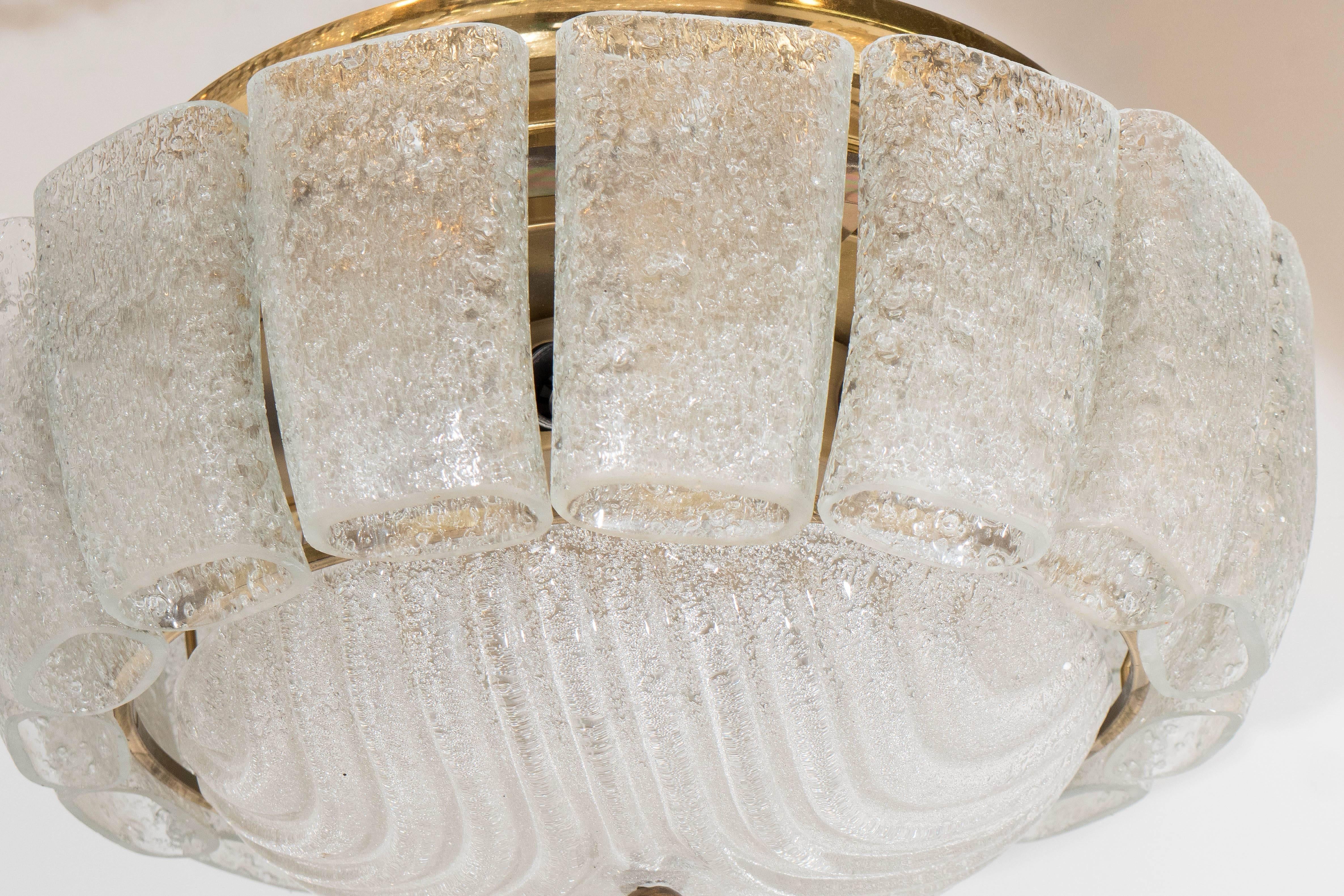 An Austrian five-light flush mount chandelier, featuring fifteen textured ice block tubes and a convex ribbed diffuser, on a brass frame. Good condition, consistent with age and use, requires five bulbs.