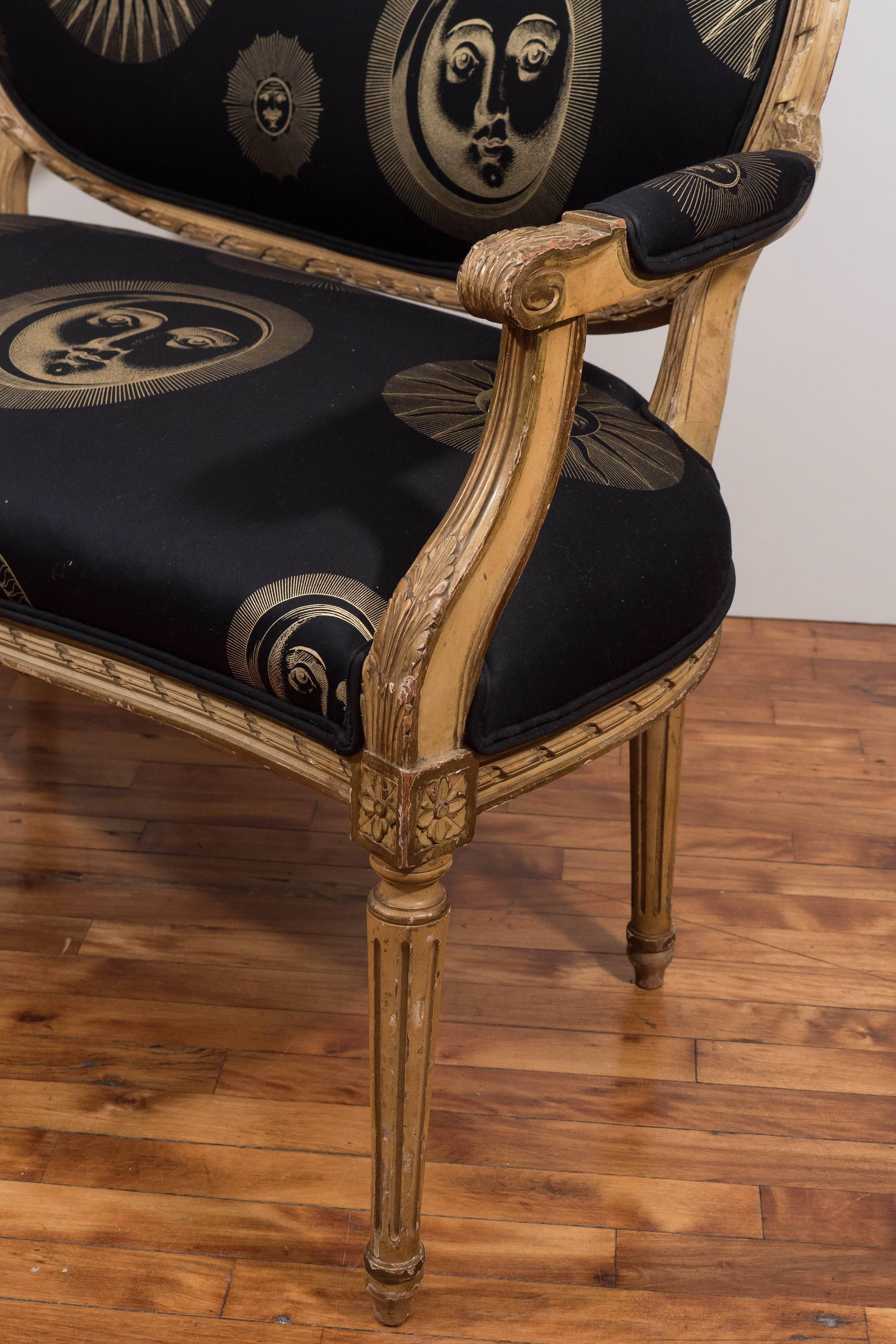 Painted 19th Century Louis XVI Style Settee with Black and Gold Fornasetti Fabric