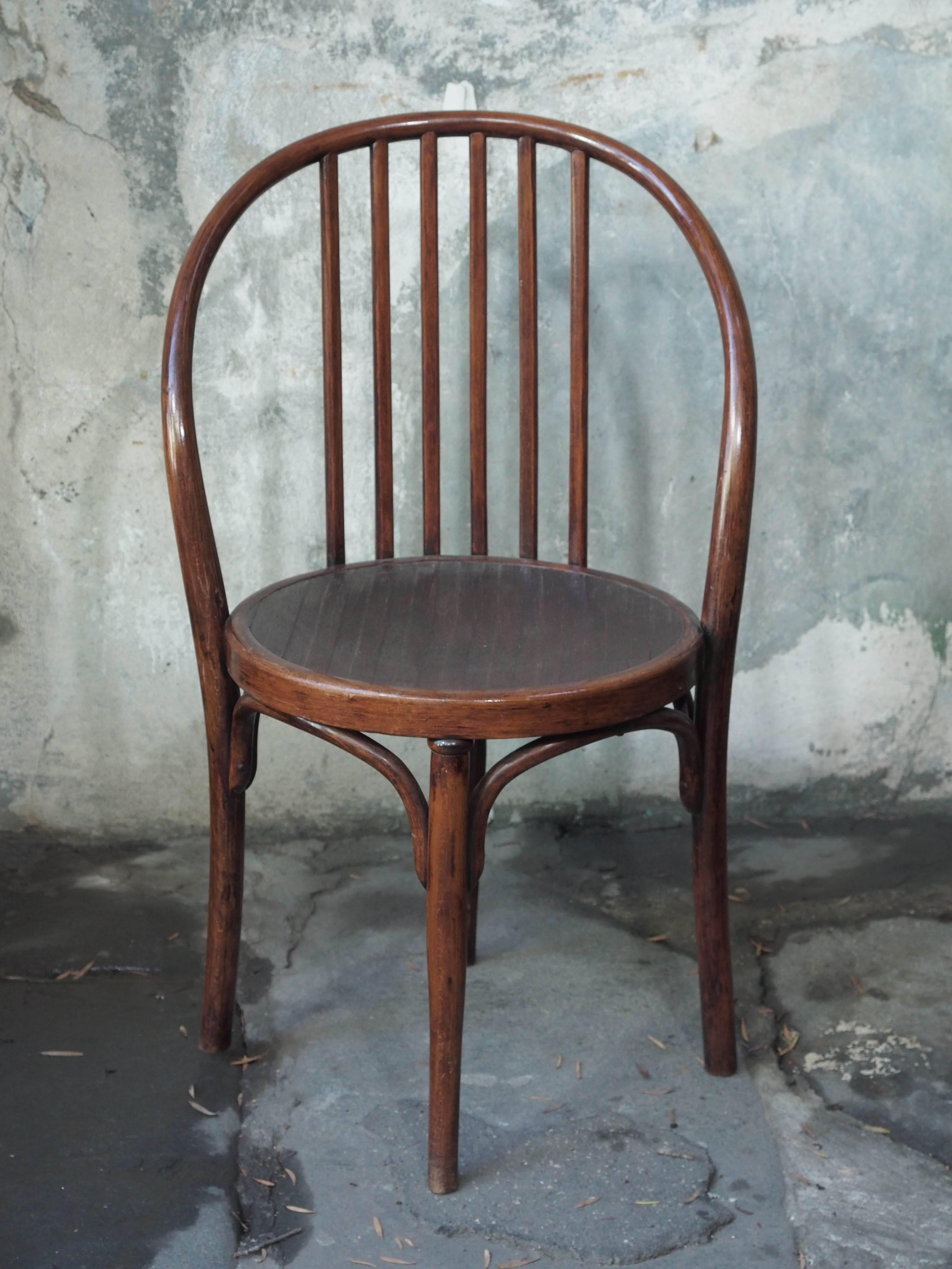 Set of four unusual and high style bentwood bistro chairs, with original paper label for Jacob and Josef Kohn, Czechoslovakia, circa 1920s
