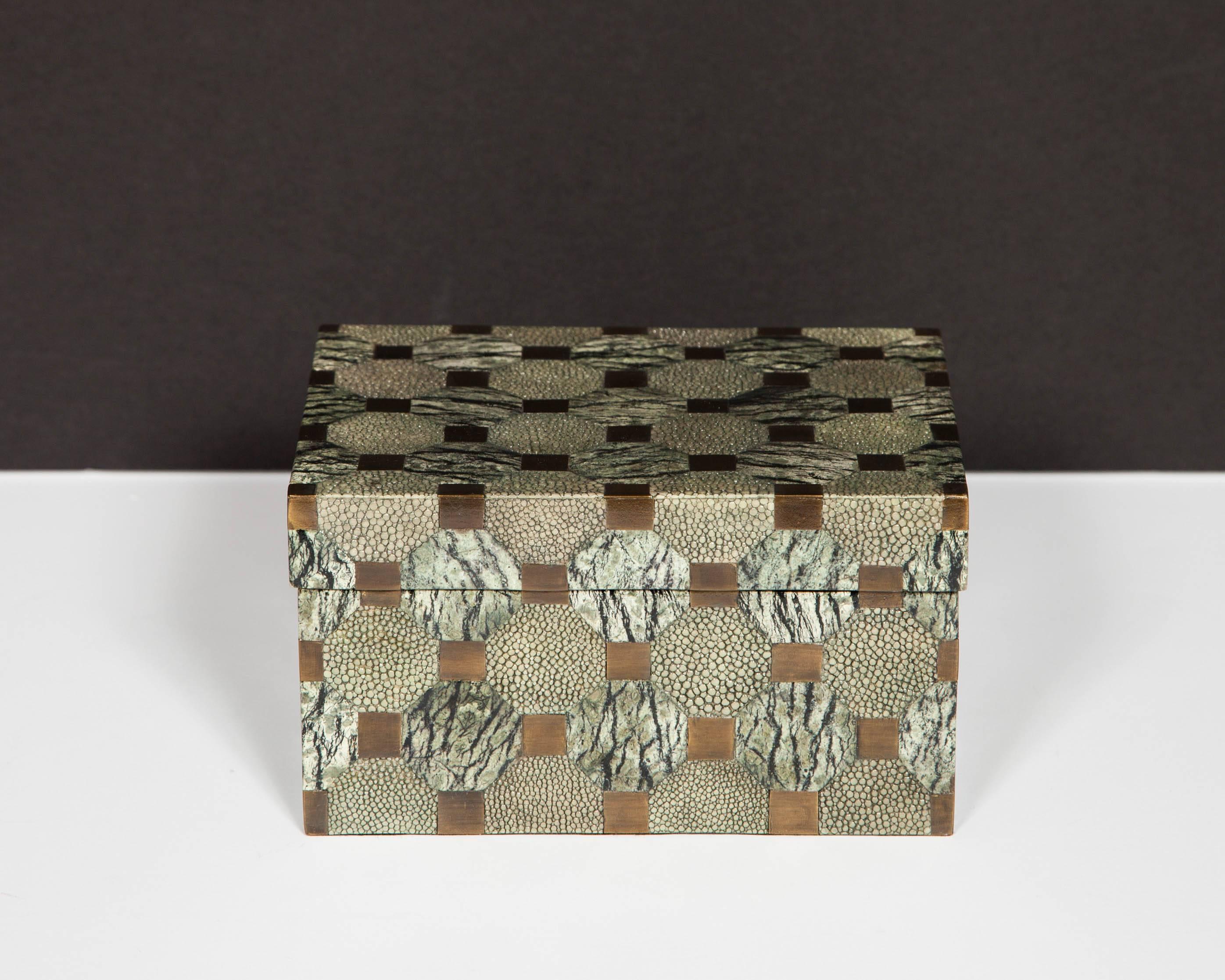 Beautiful handcrafted lidded box with geometric pattern, comprised of alternating octagon shapes of grey shagreen and hand-painted lacquered wood with zebra hued veining. The shapes are separated by bronze square inlays, which contribute to the