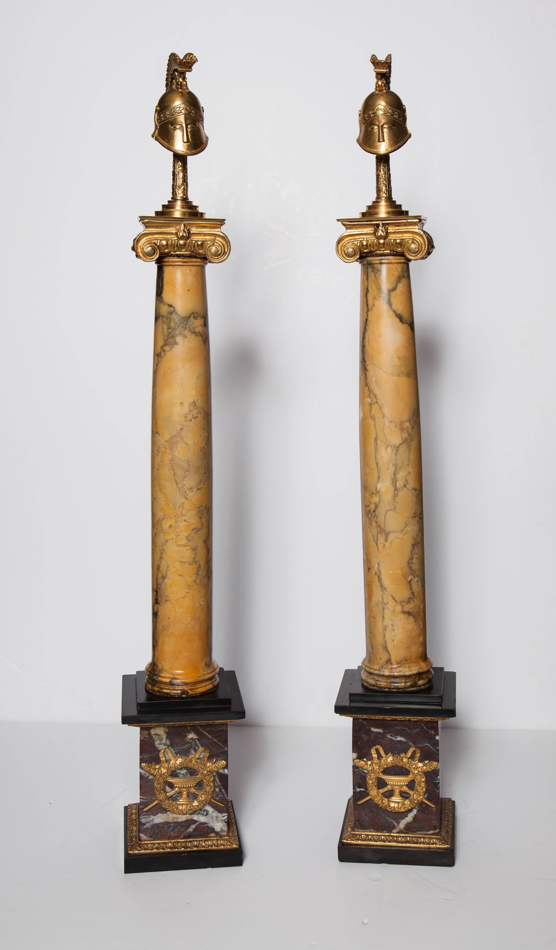 A very unusual and quite large pair of Antique Russian Dore Bronze, Sienna marble and Jasper, Neoclassical style, Military Helmet (Trophy) form standing Obelisks. Each ormolu Helmet sitting on a Roman Corinthian column,
Russian circa mid 1800's
H: