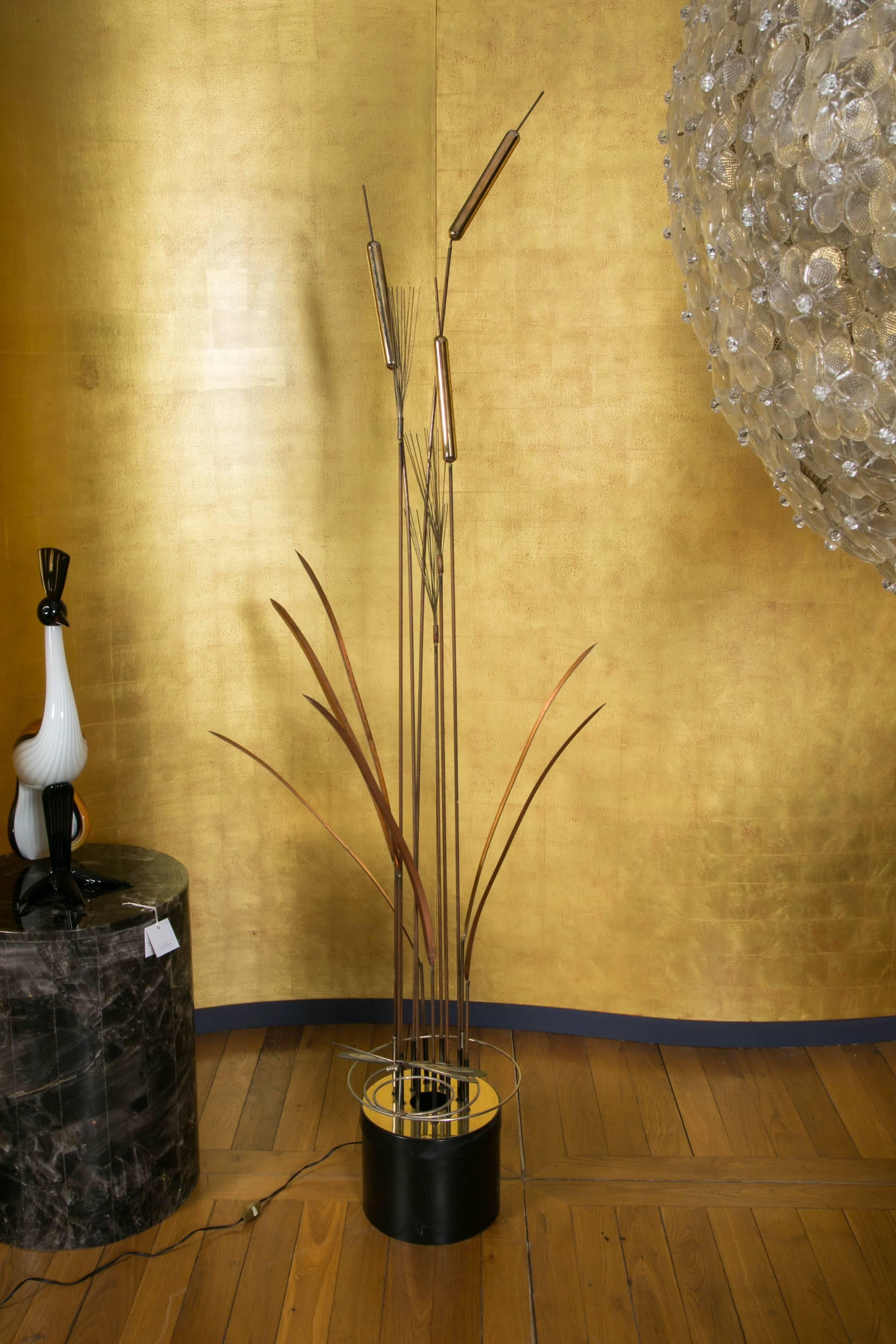 Brass floor lamp with reeds, by C. Jere.