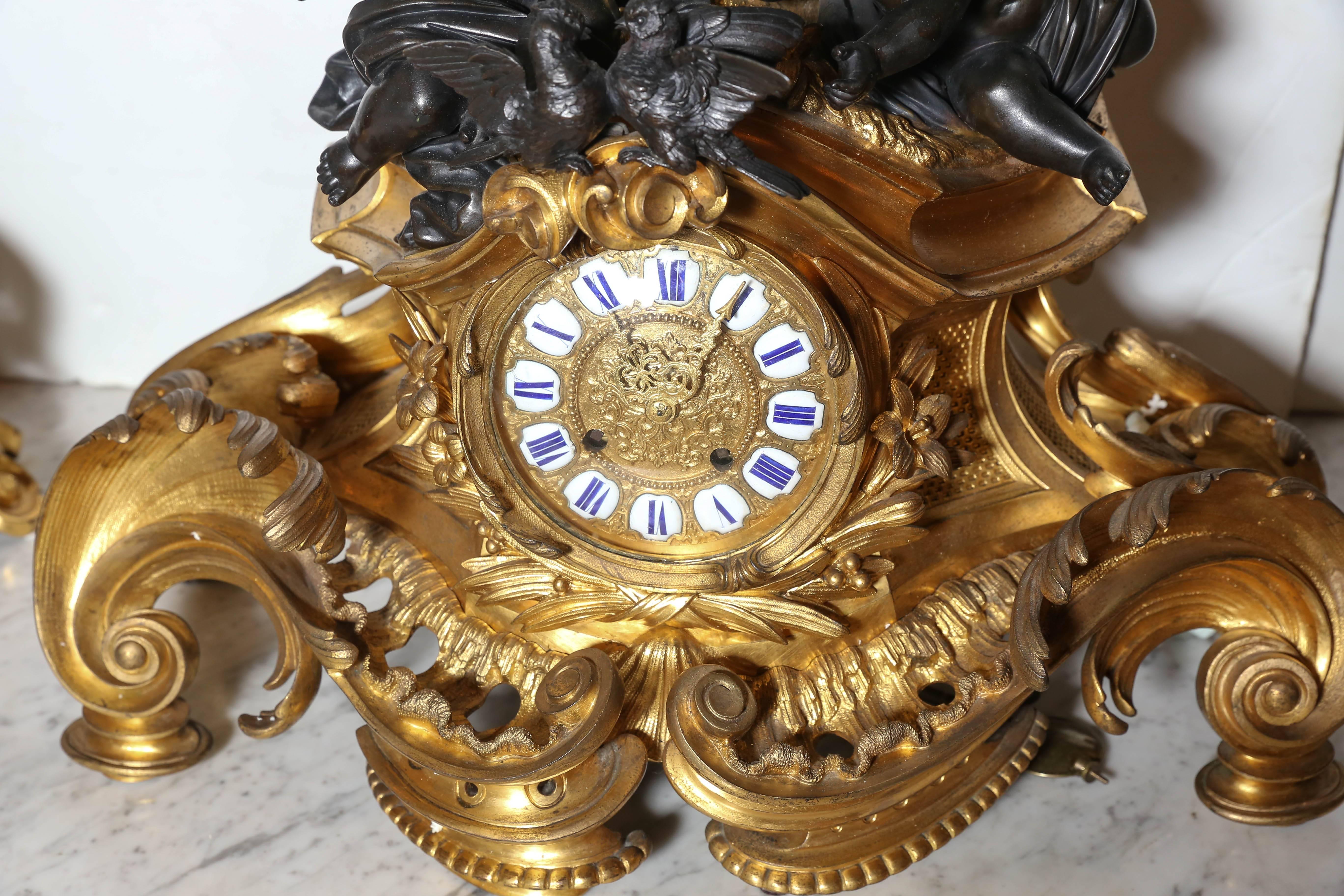 French Three-Piece Gilt and Patinated Bronze Clock Garniture Set
