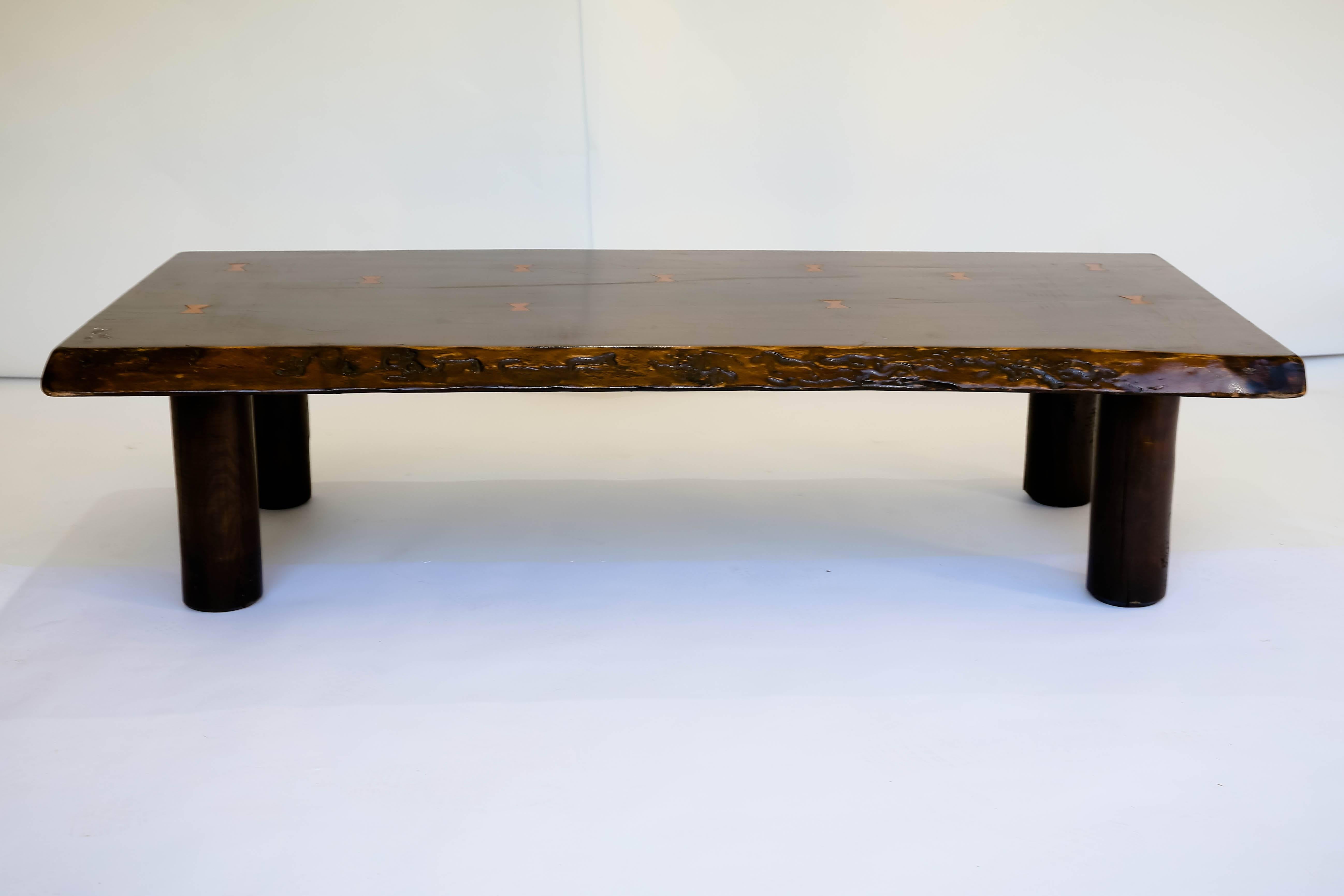 Solid wood live edge table with contrasting butterfly joint details on top - round tubular legs, excellent patina. 
