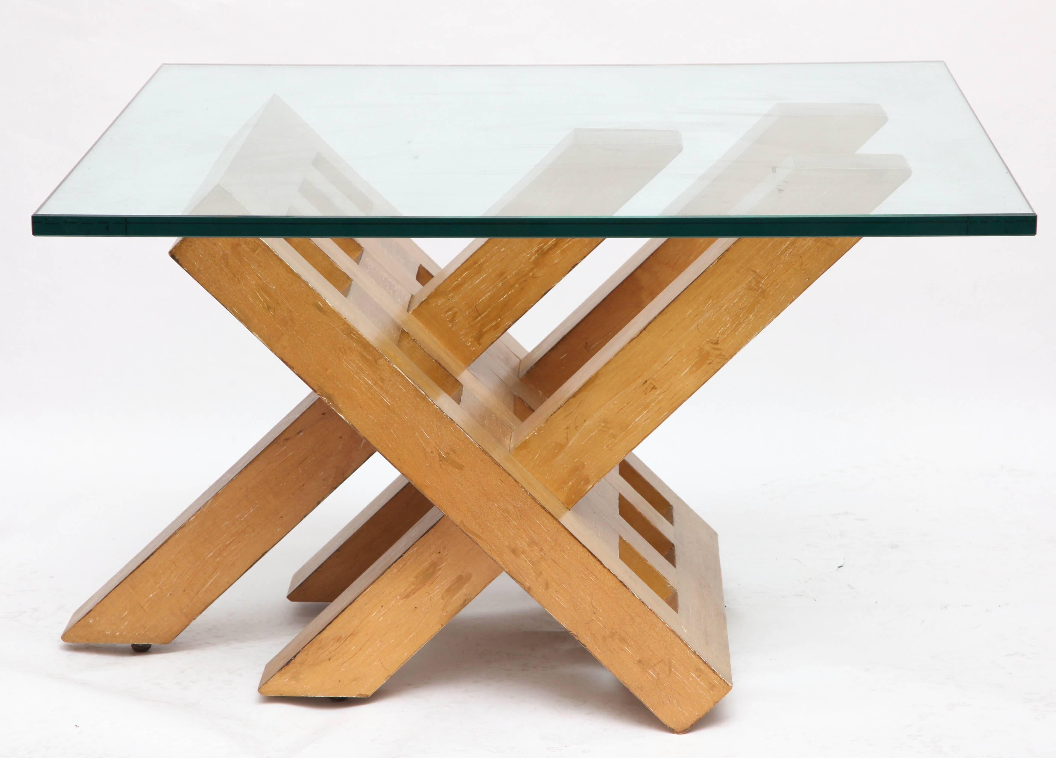 A 1940s art modern architectural wood and glass table.