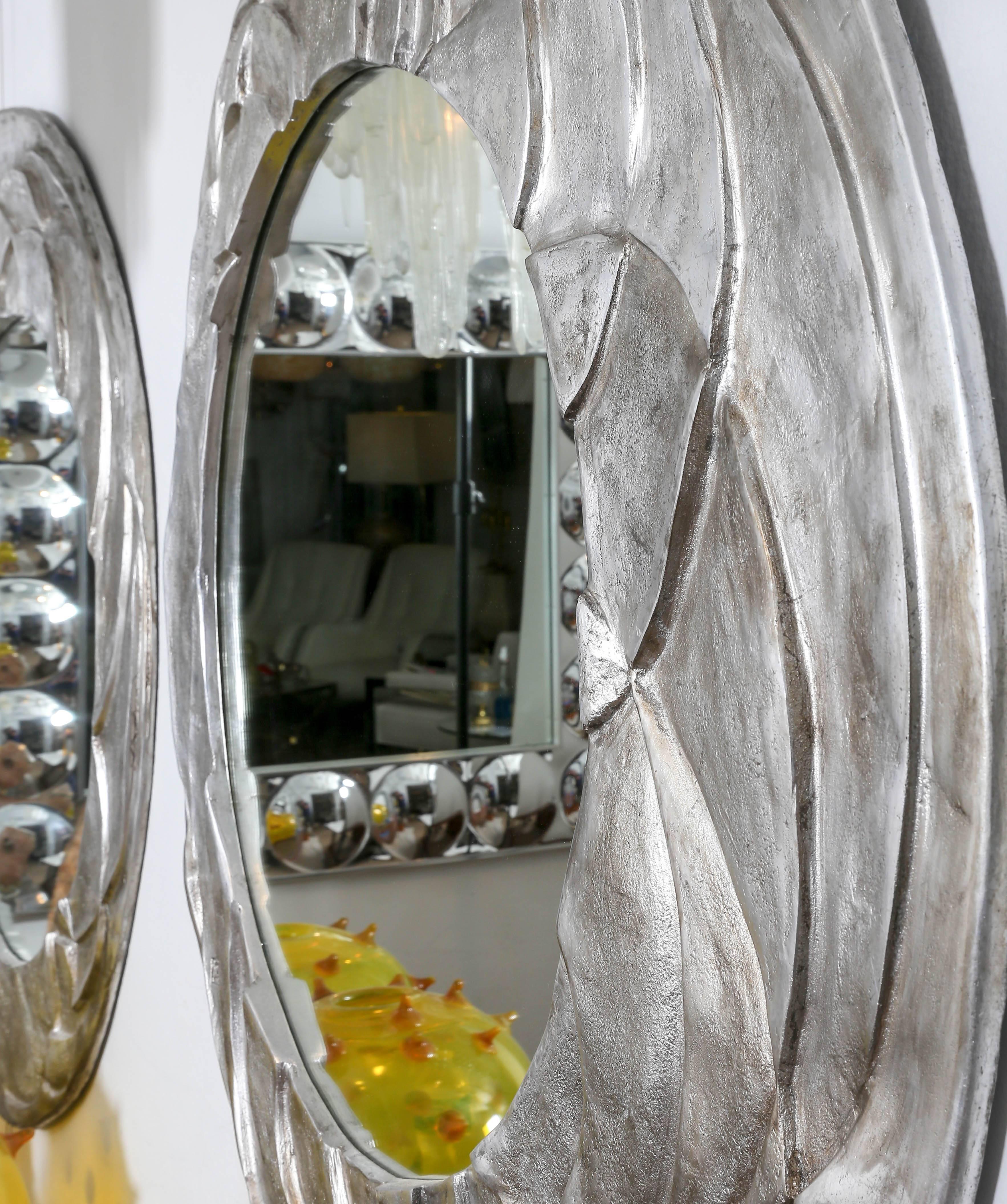 Italian Asymetrical Ovoid Mirror with Textured Relief Aluminium Surround