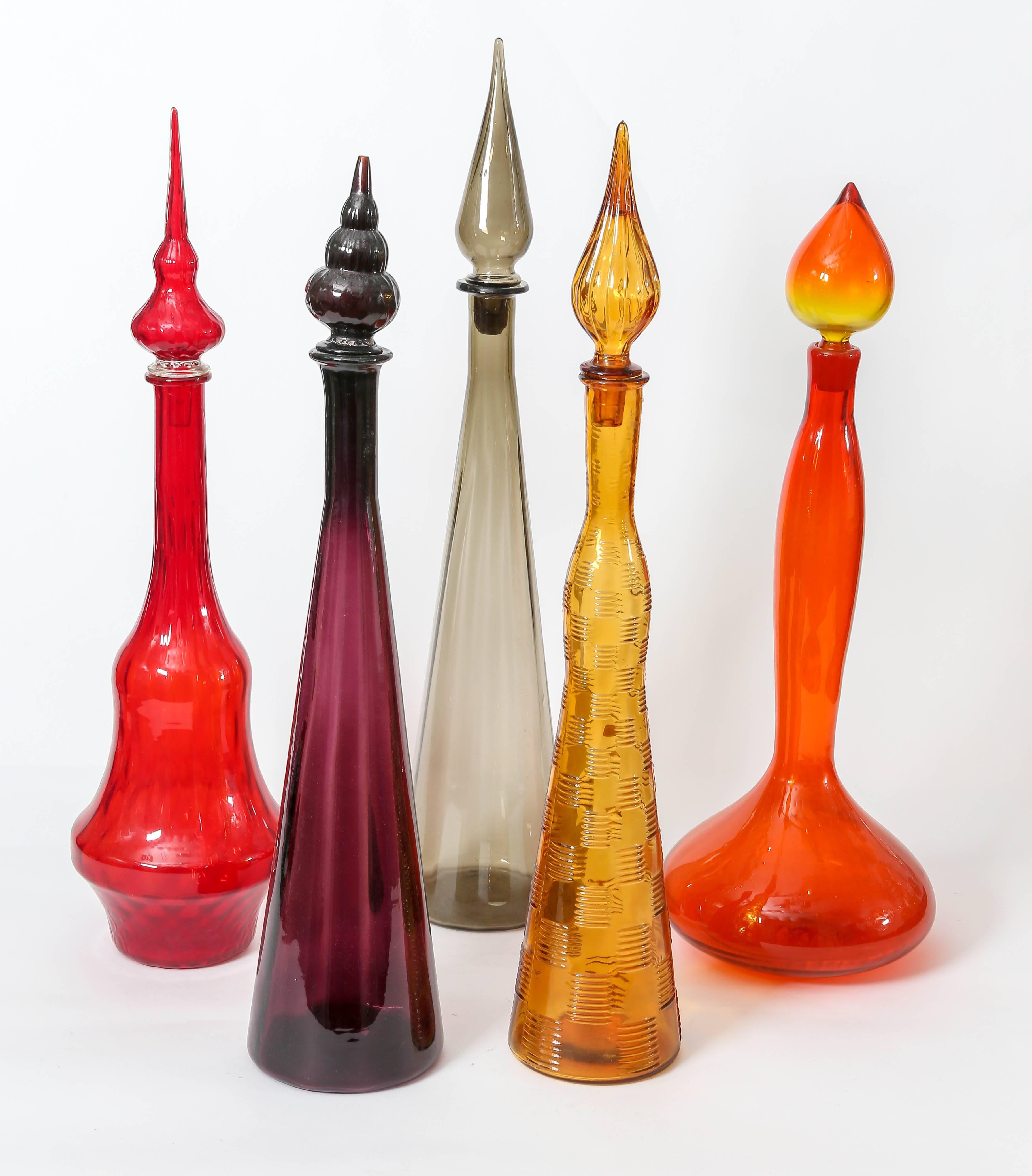 Colorful vintage glass bottles with stoppers, purple and smoke only.