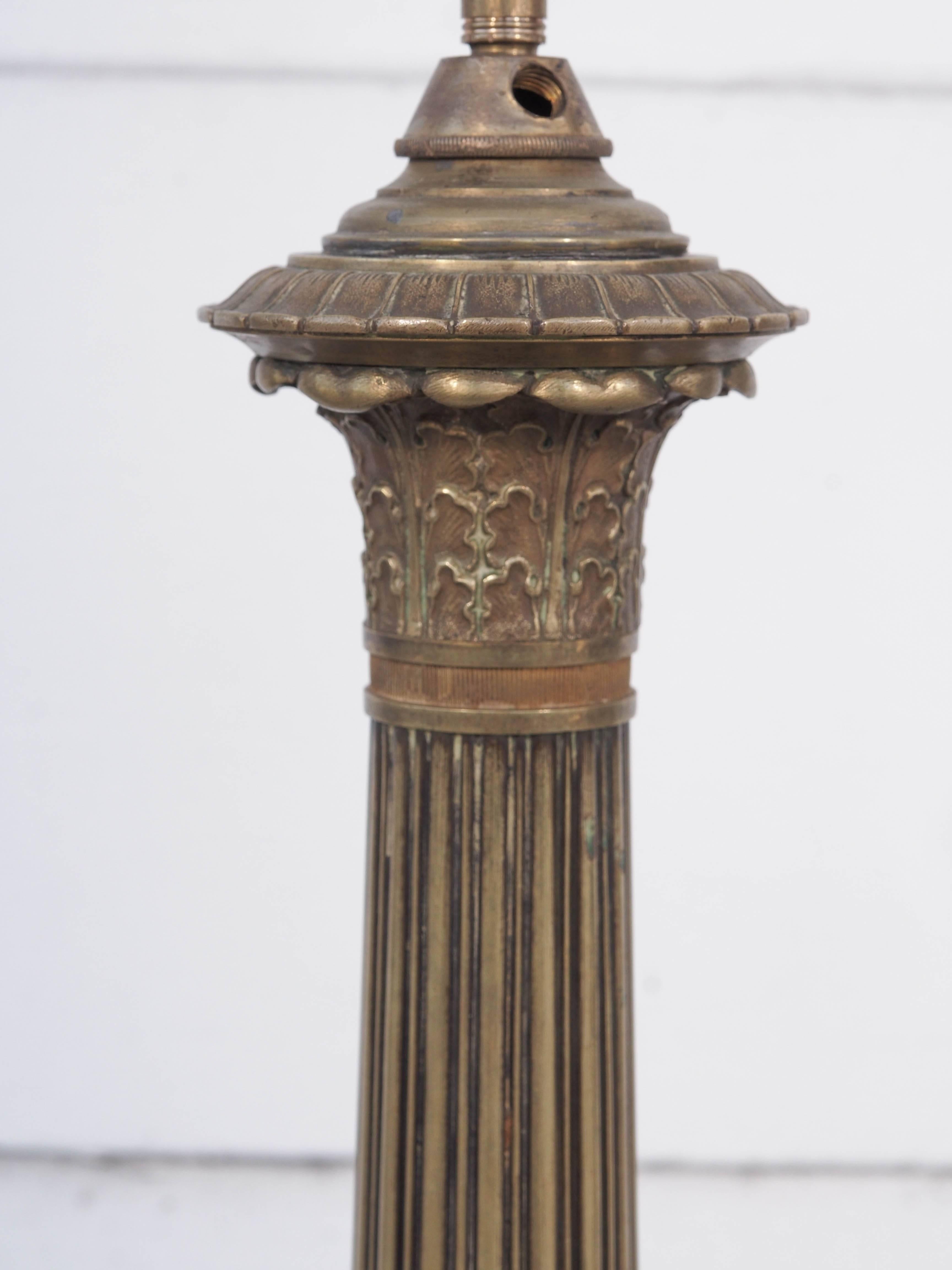 Pair of bronze trifed base column lamps from candlesticks.