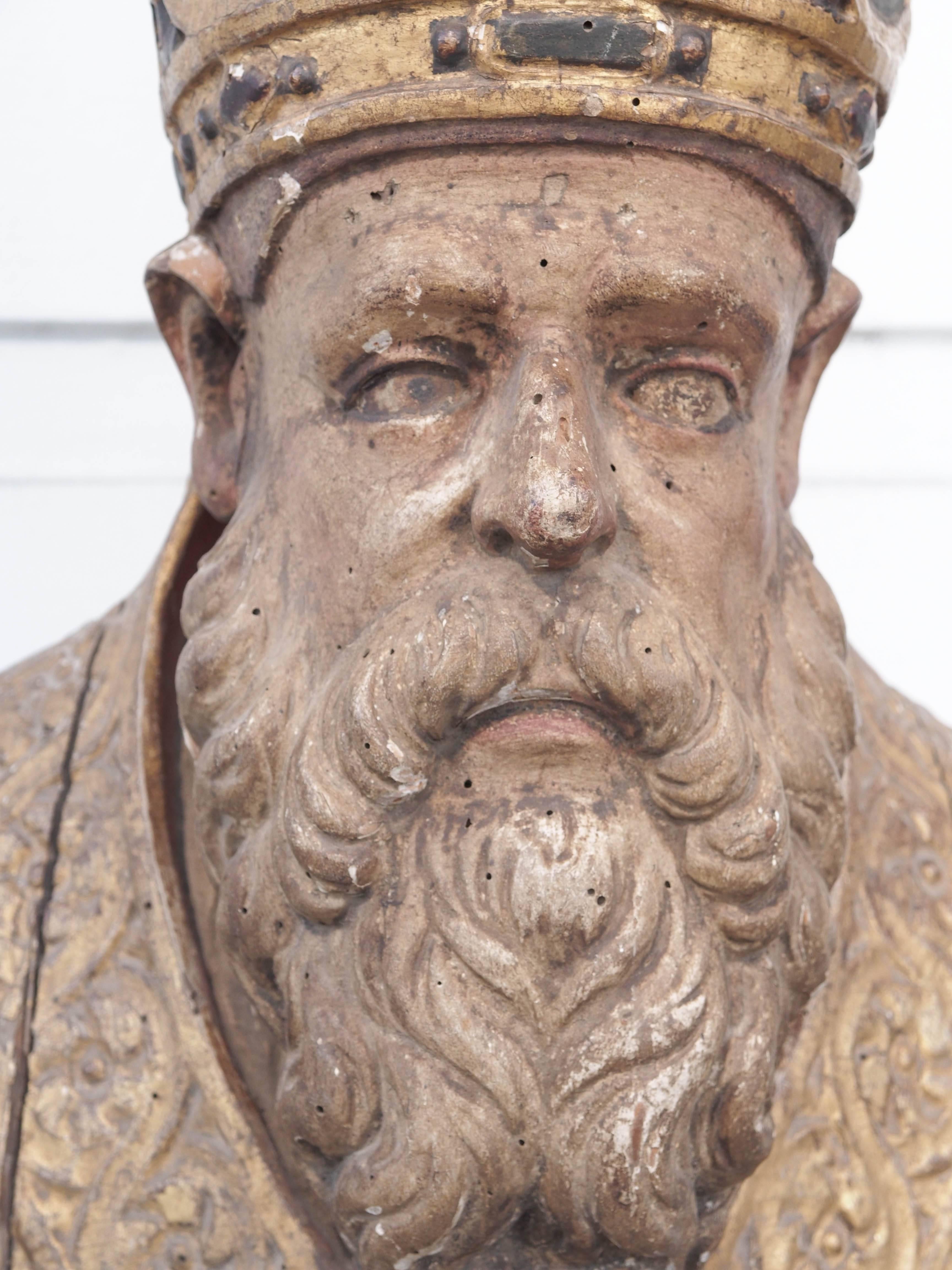 Spanish Baroque reliquary bust of a bishop of gilt and polychrome carved wood.
 
