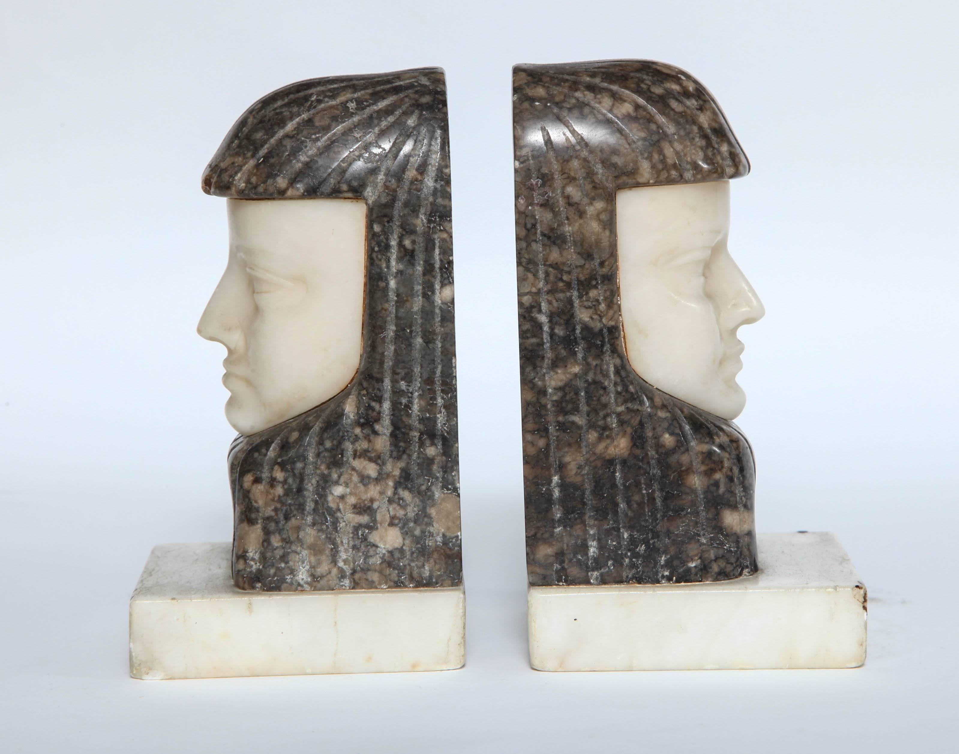 A wonderful pair of Egyptian Revival Art Deco bust bookends in alabaster and marble.