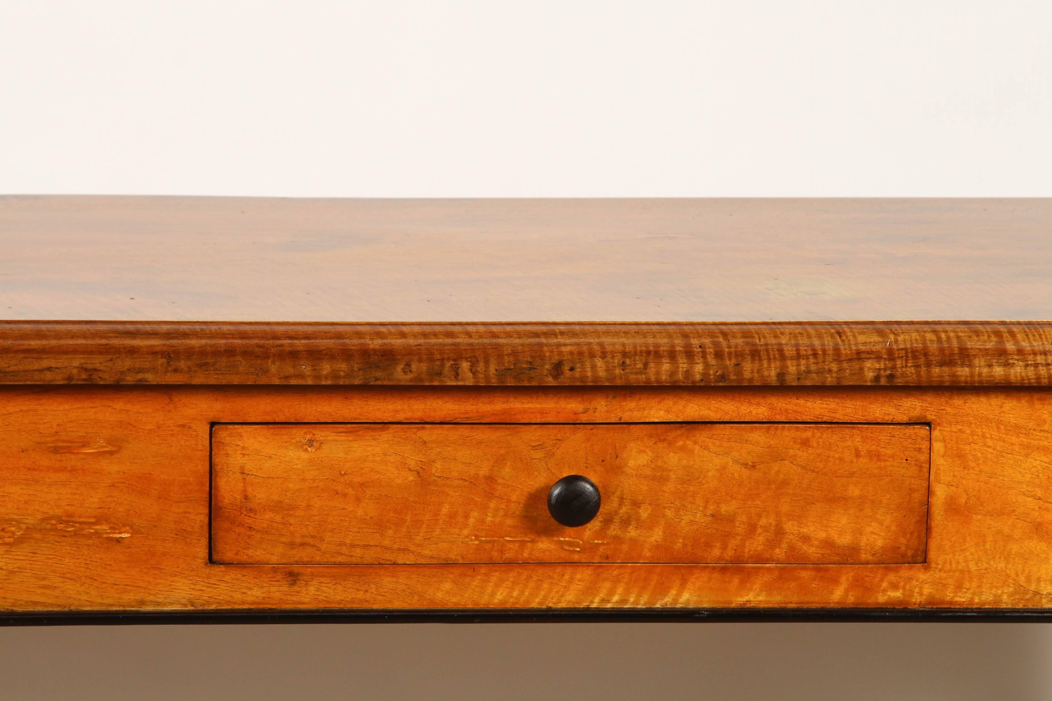 This large and attractive console table is made of solid and figured tiger wood from Vietnam, for the local French market. 