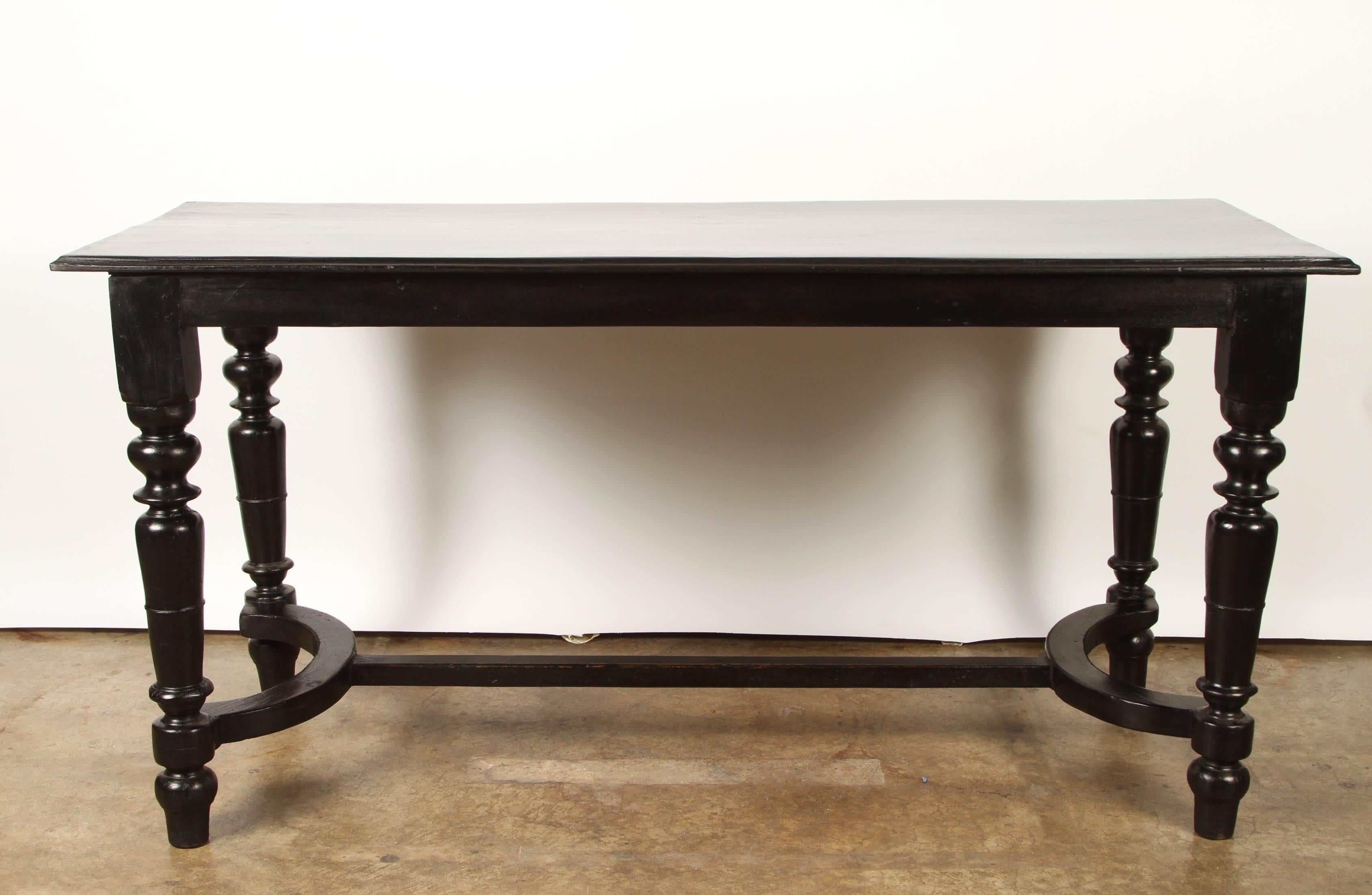 Made for the local French market, this Vietnamese console table is made from solid indigenous rosewood. The top of this rosewood table is supported by four turned legs and a central stretcher.