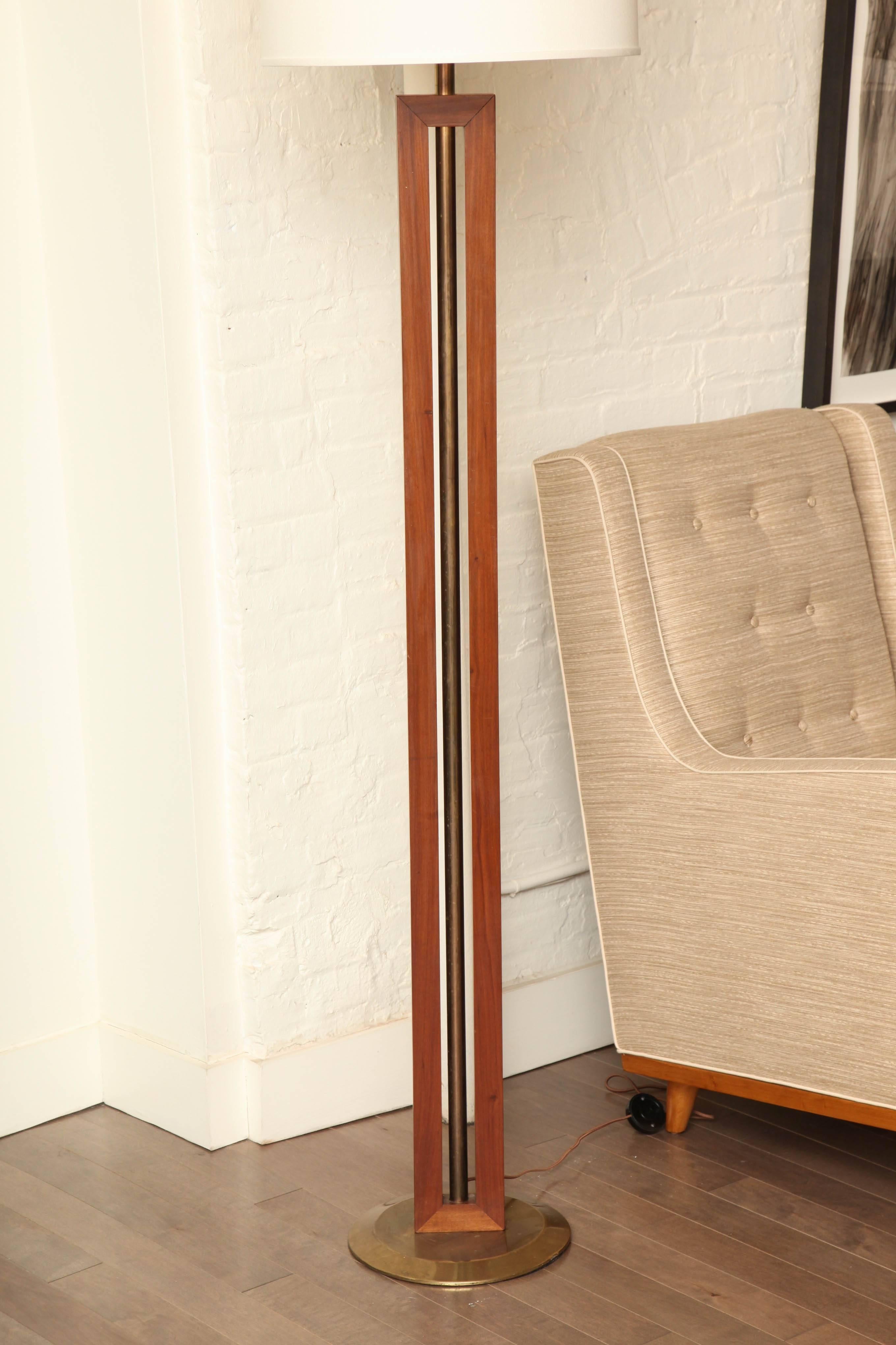 Tall wood with brass floor lamp. Newly rewired with a three bulb cluster and both pull chain and floor switch, new ivory linen shade, France, circa 1970.