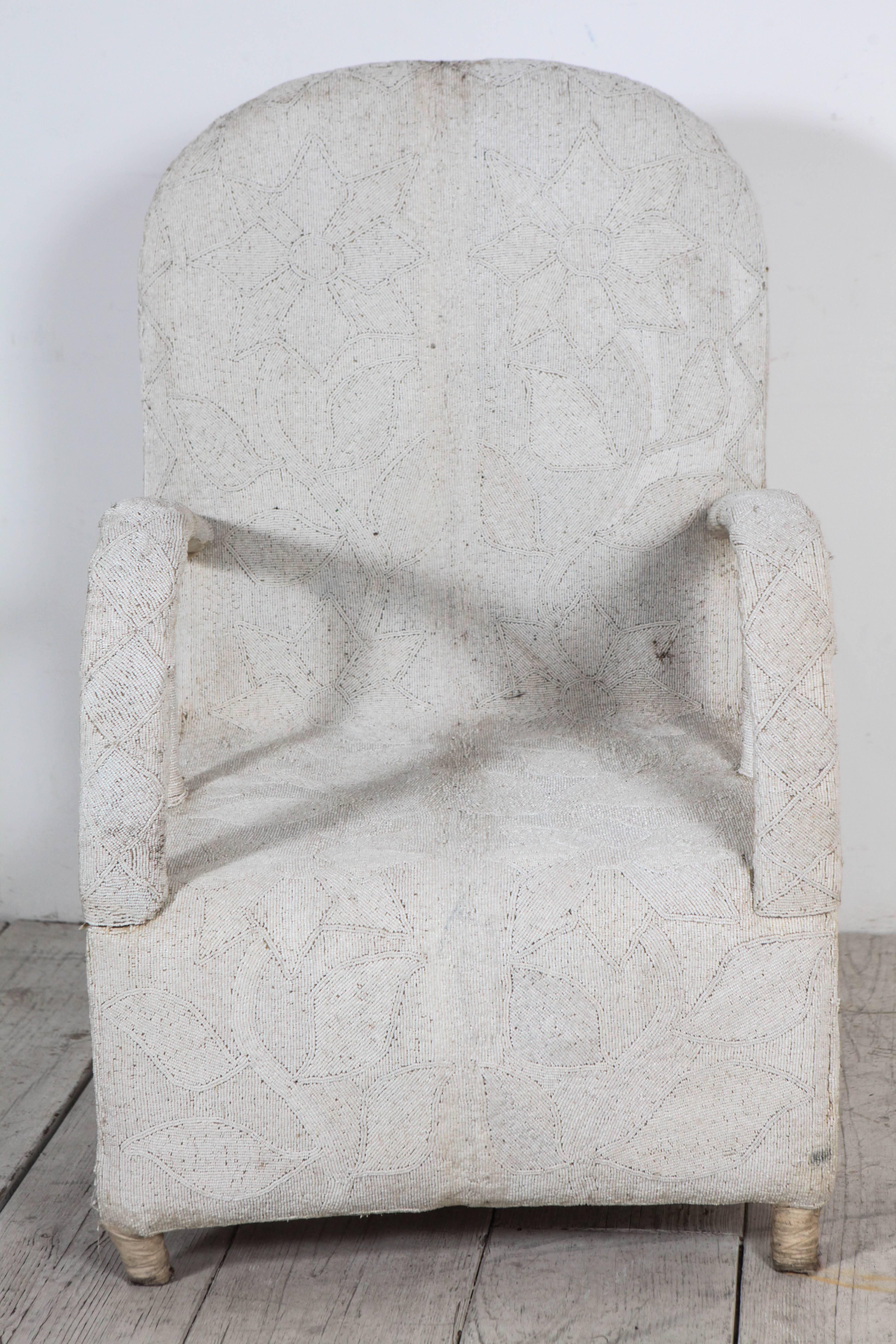 Rare sculptural arm chair in all white beading.