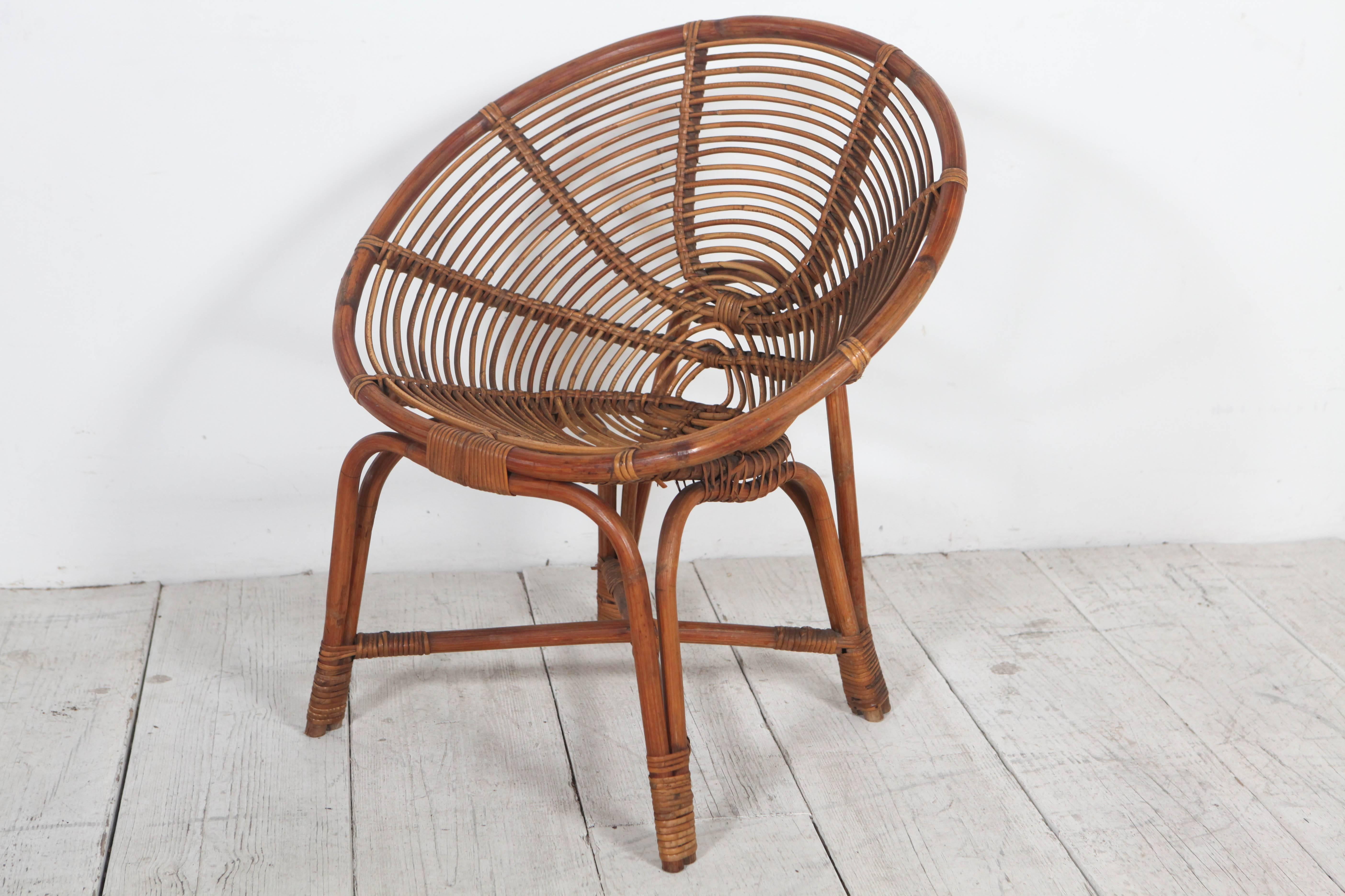 Wicker rattan round occasional chairs.
