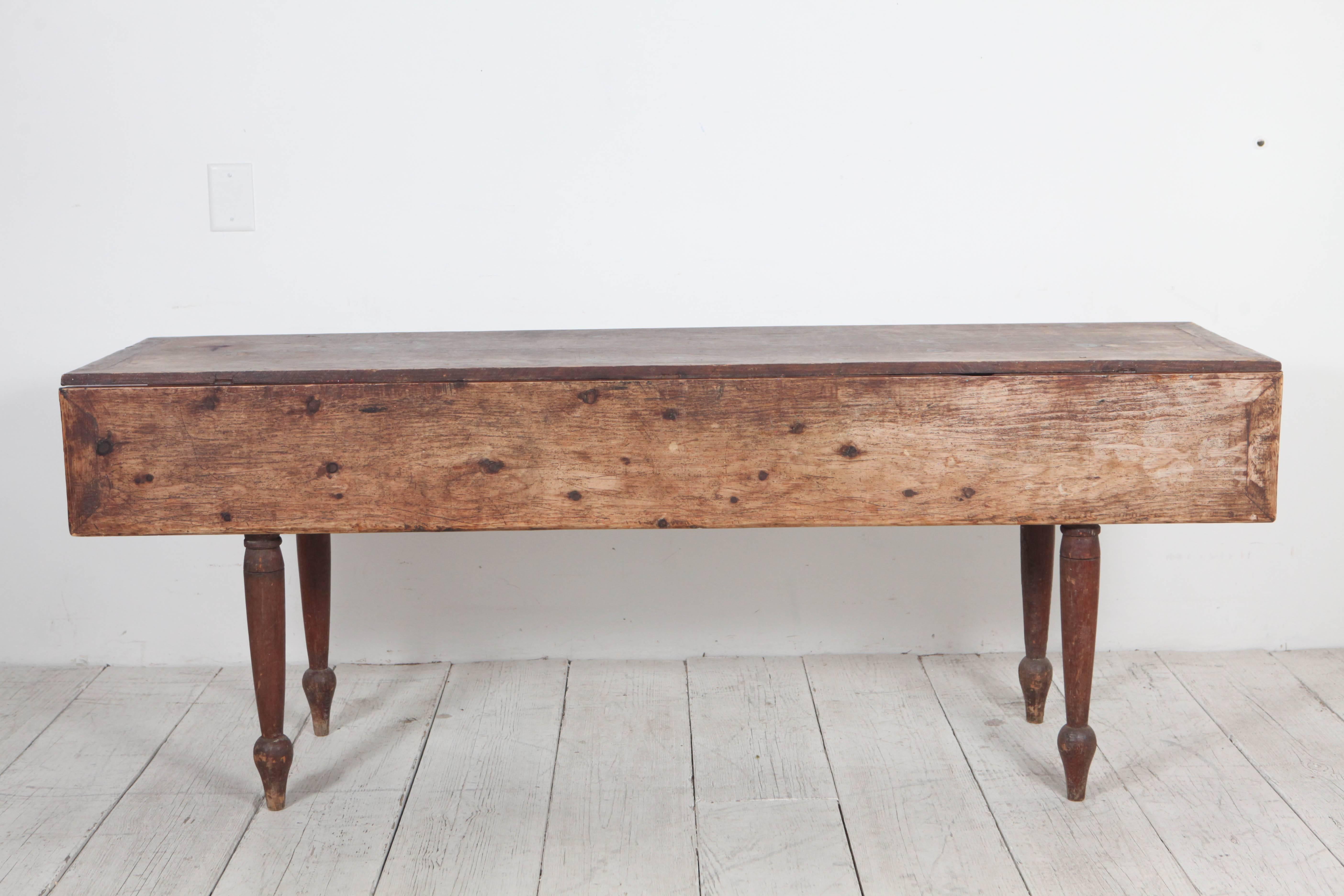 Farm style drop-leaf table or console. When closed table measures 72