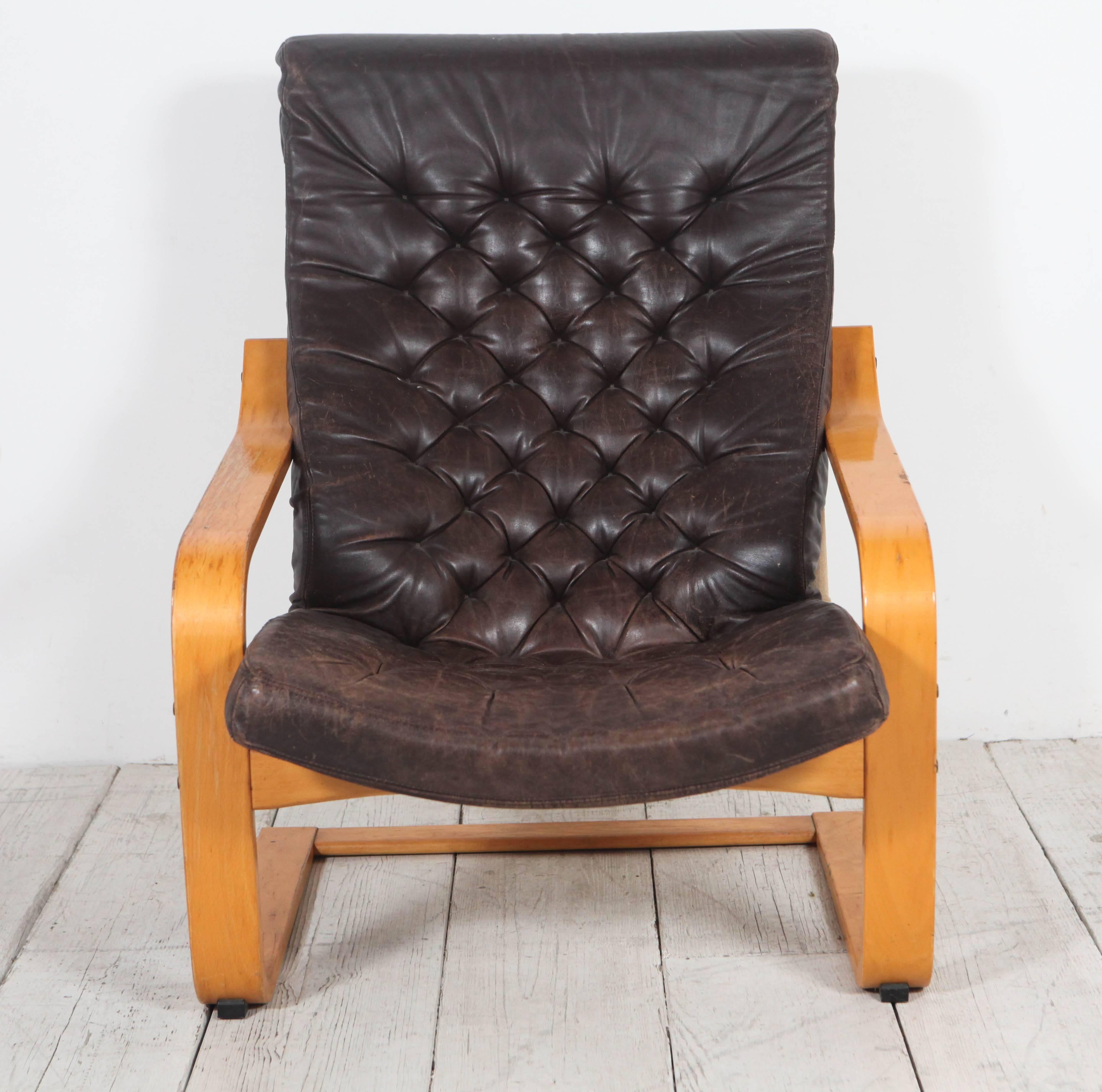 Pair of IKEA's iconic chair from circa 1971-77 designed by Noboru Nakamura and upholstered in thick tufted chocolate black leather.