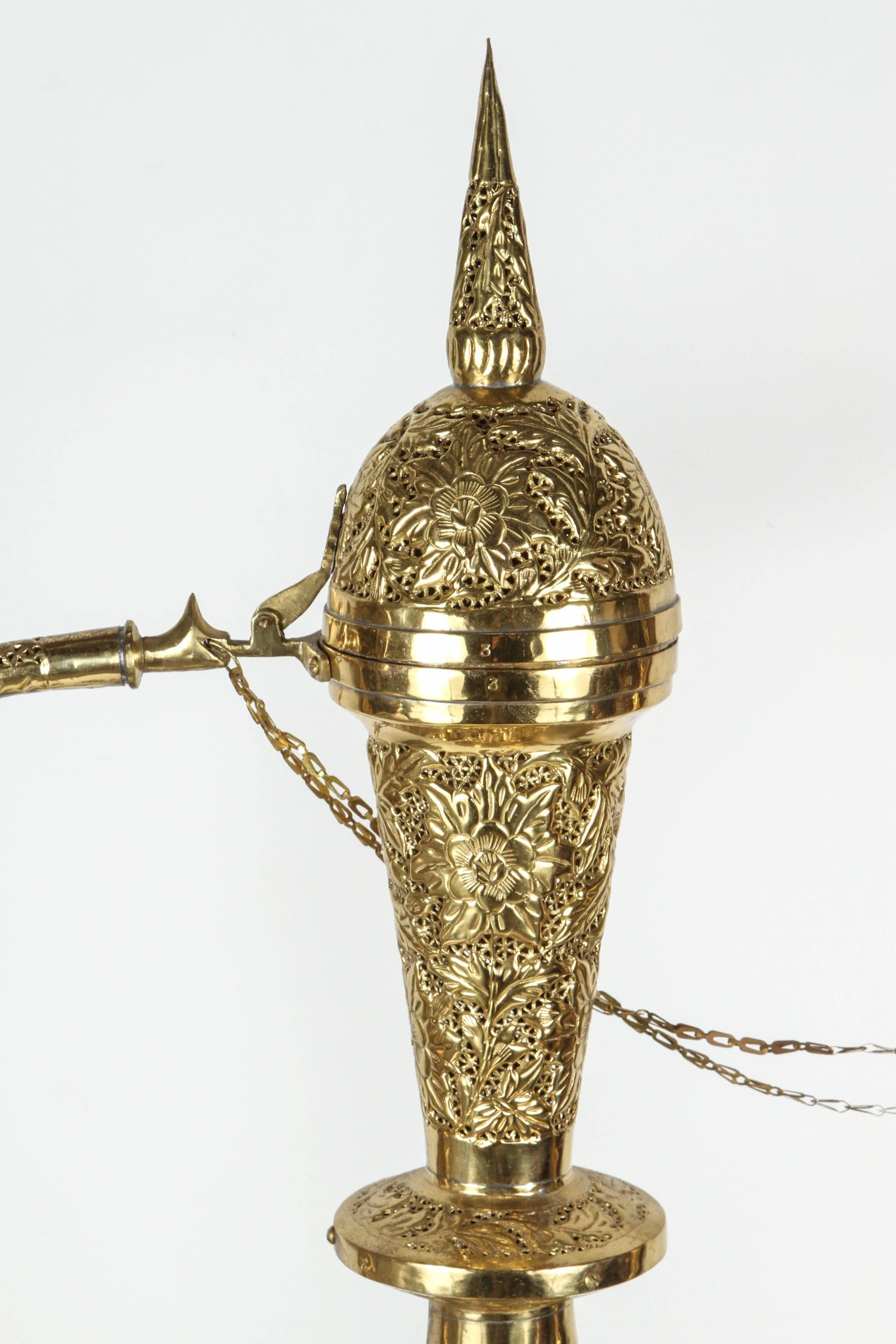 Oversized 4 feet tall Middle Eastern Turkish brass decorative ewer turned into a lamp.
Very decorative handcrafted polished brass Arabian style Turkish table lamp or floor lamp.
Hand-hammered and pierced brass with floral intricate Moorish islamic