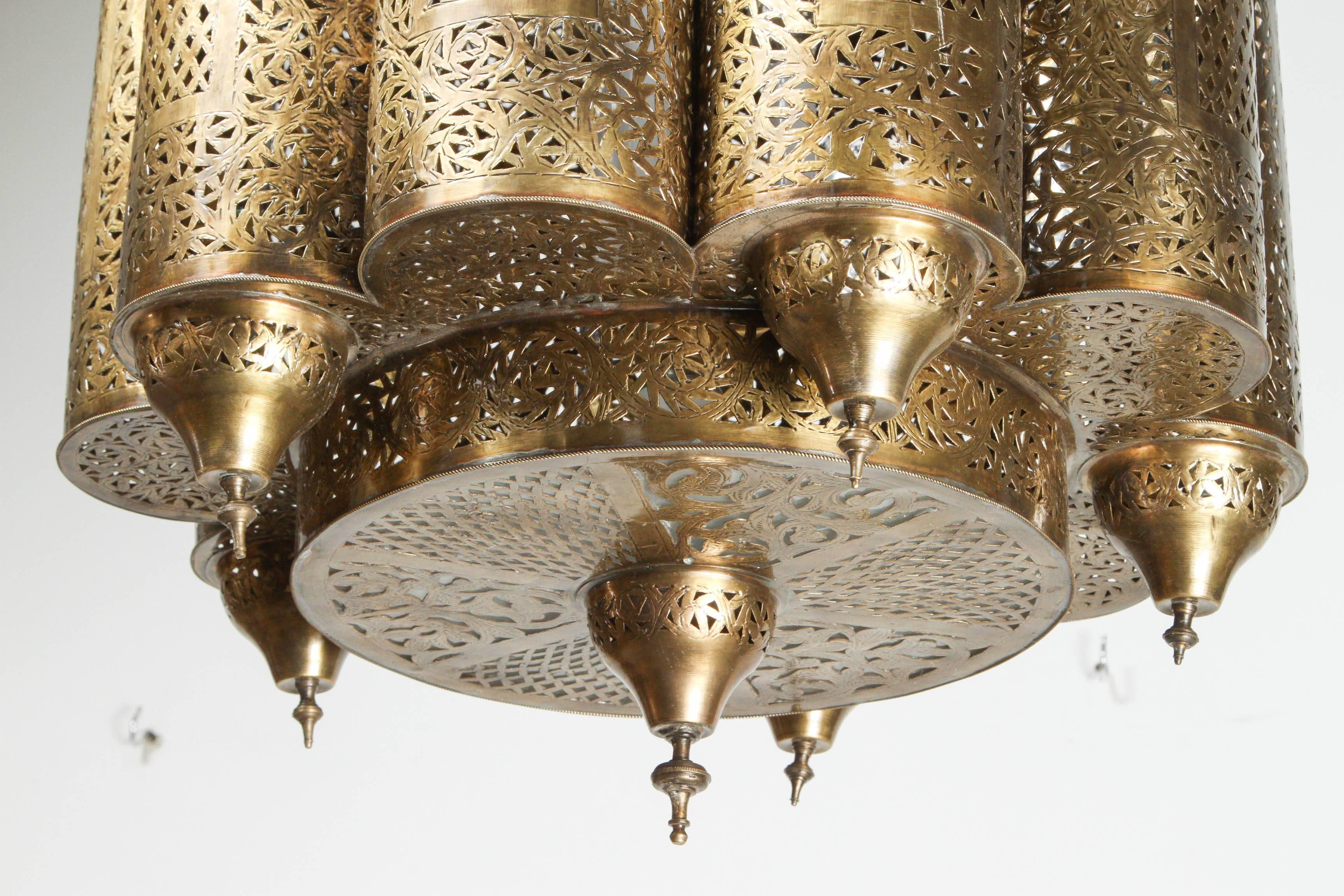 Brass Moroccan Mosque chandelier in the style of Alberto Pinto.
Moroccan Brass light fixture, delicately hand-crafted, hand-hammered and chiseled with fine filigree designs by skilled Moroccan artisans.
The size of the light fixture is 22" H