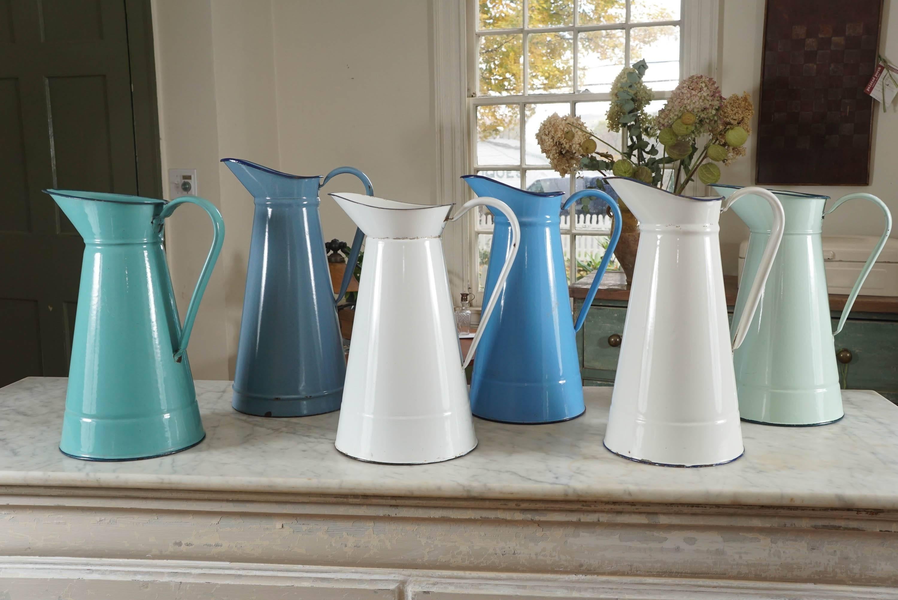 This collection of English pitchers are the nicest assortment of colors we have had in a long time. Each is appropriately worn and each is a slightly different height and diameter. We are listing the tallest piece and widest diameter. They range in