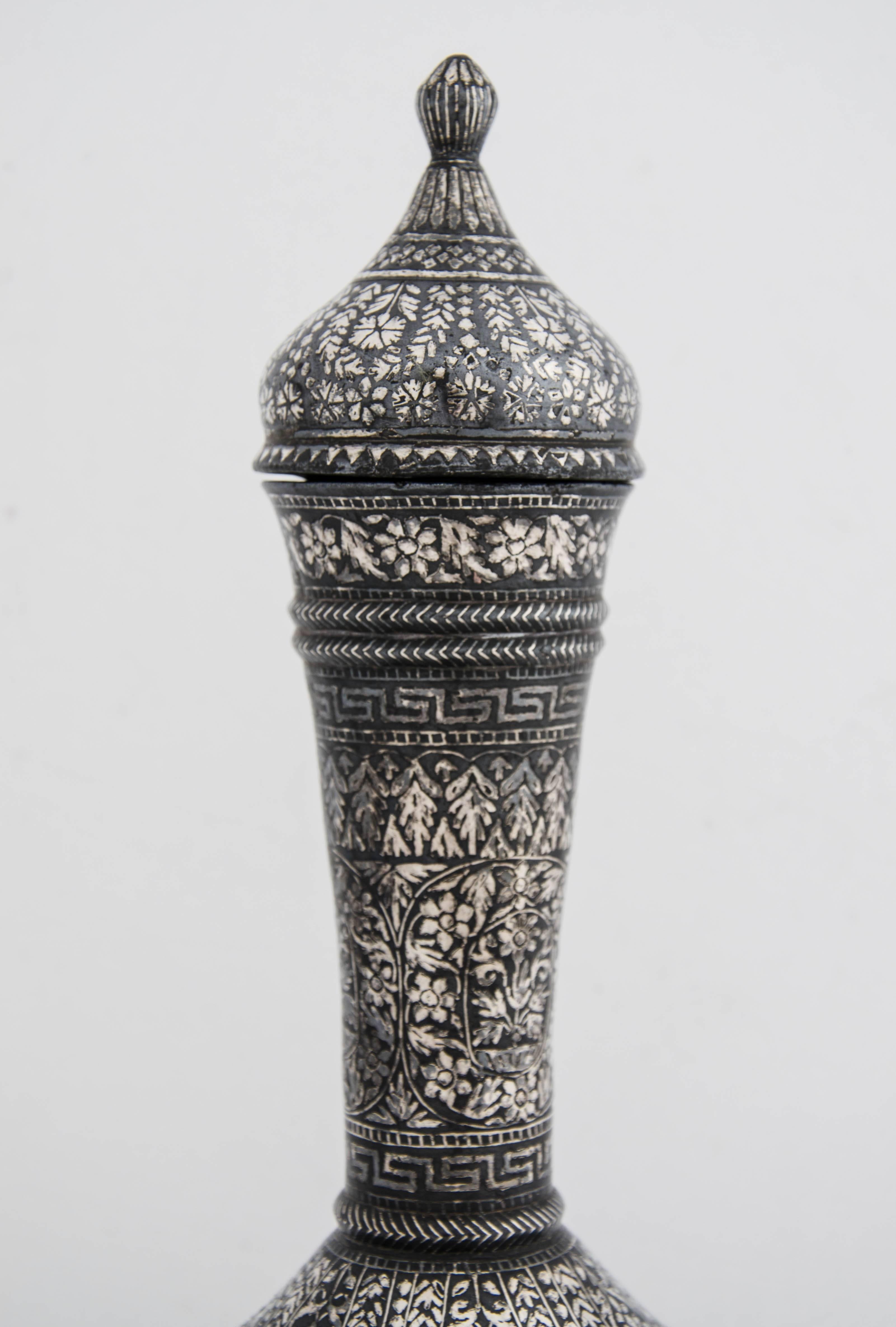 A Silver inlaid Bidriware water bottle with lid.