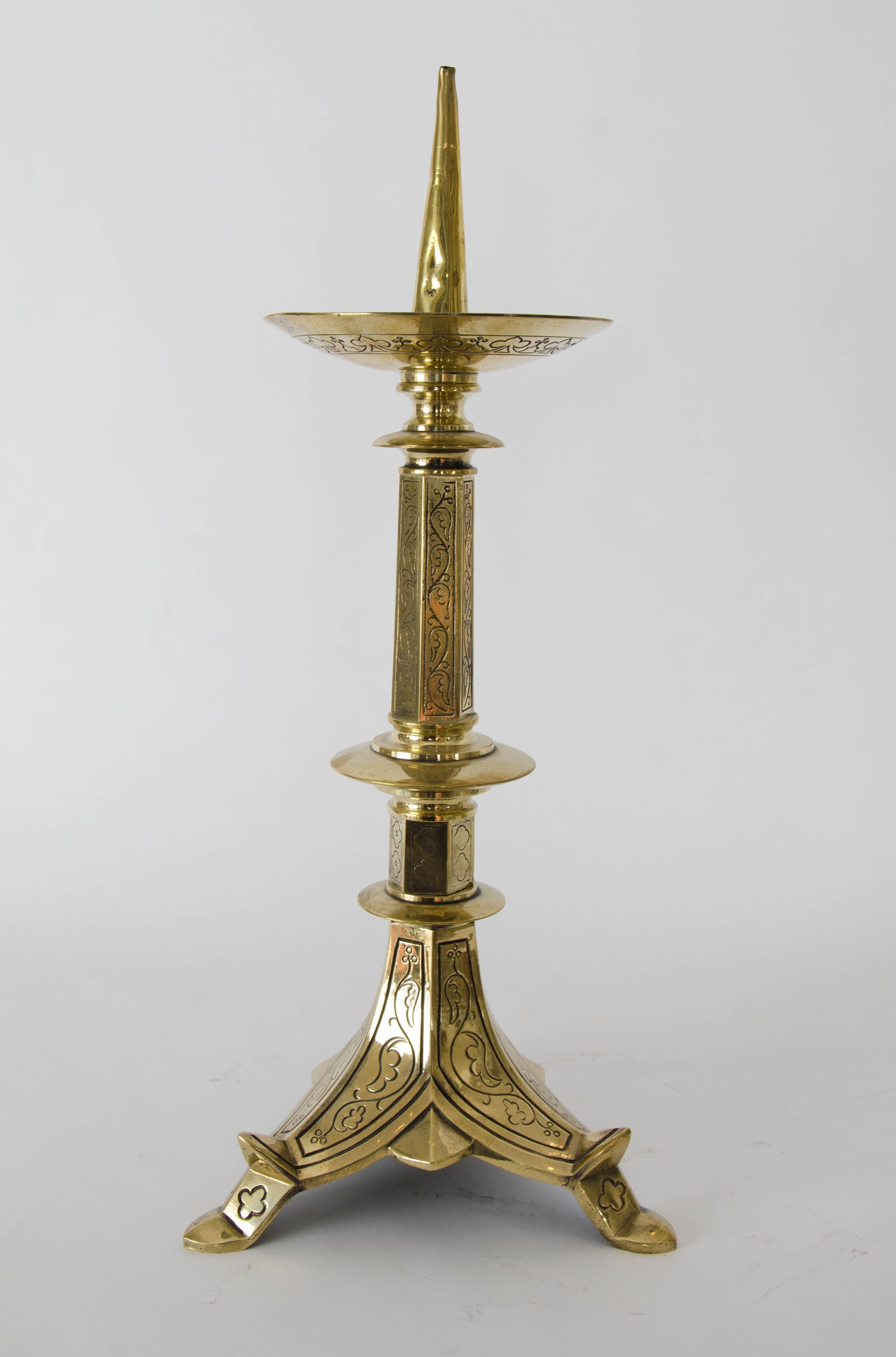 A pair of late 19th century gothic brass picket candlesticks.