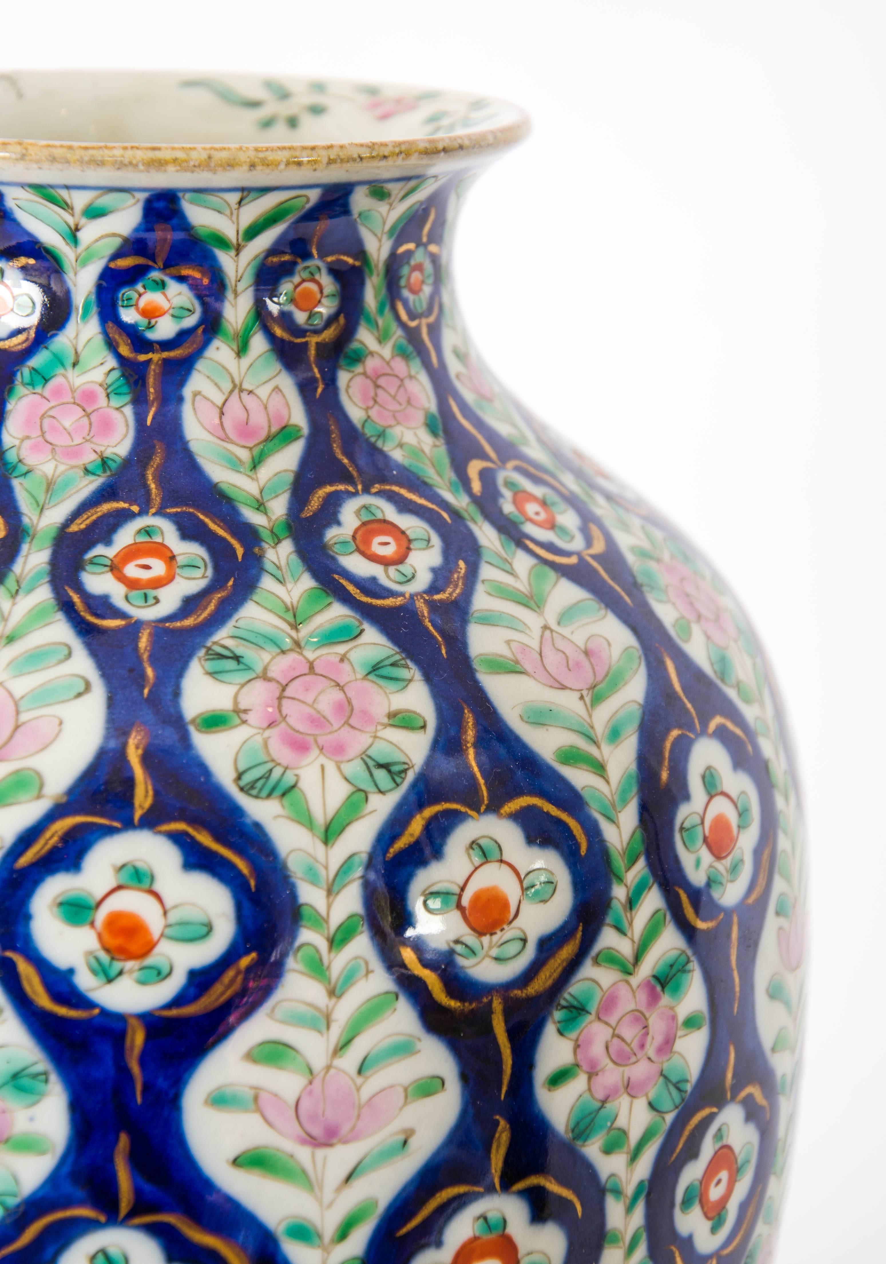 A late 19th century Chinese vase in blues, greens and reds