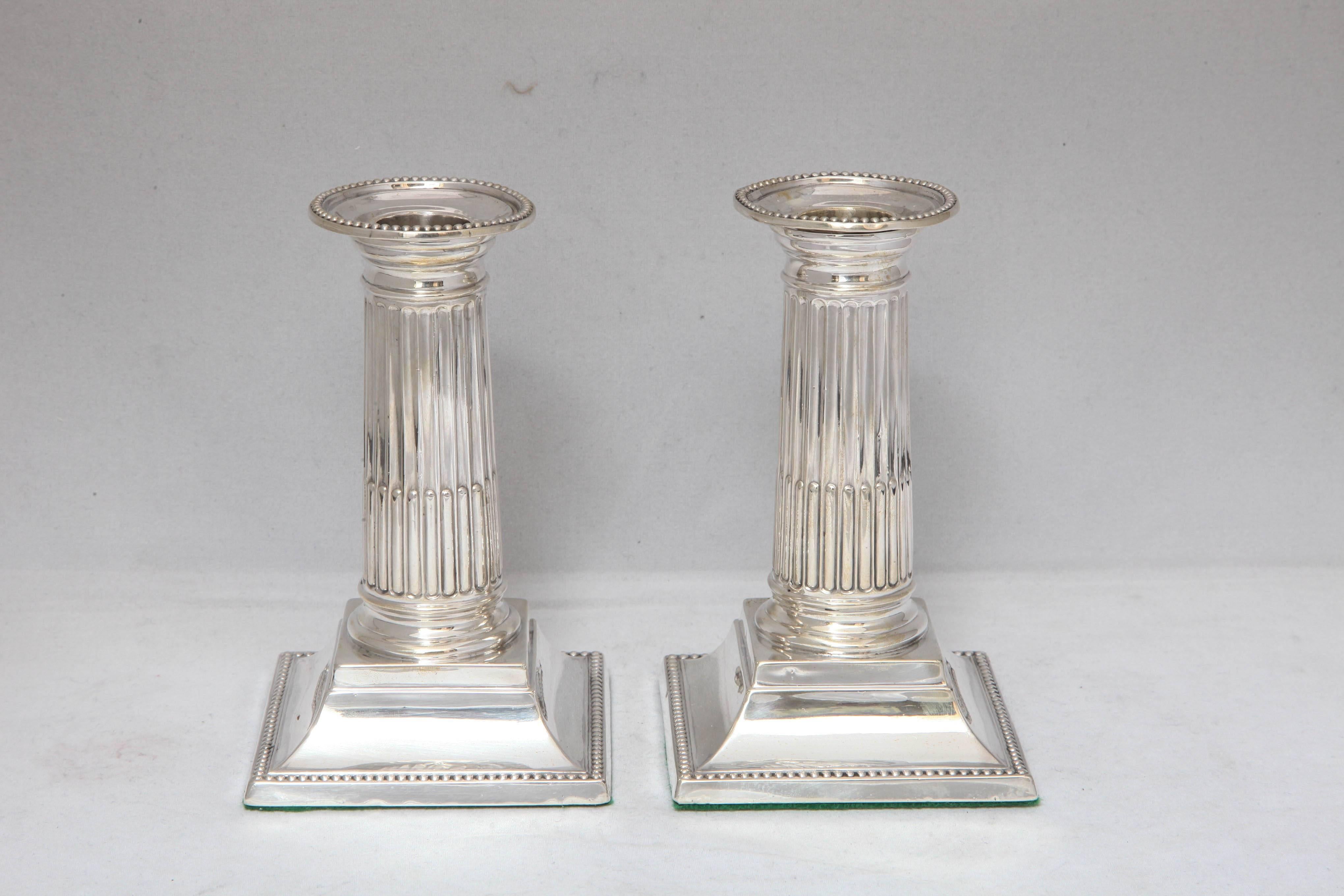 Beautiful pair of Victorian, sterling silver, column form candlesticks, Sheffield, England, 1891, George Heath - maker. Measures: 5 1/2