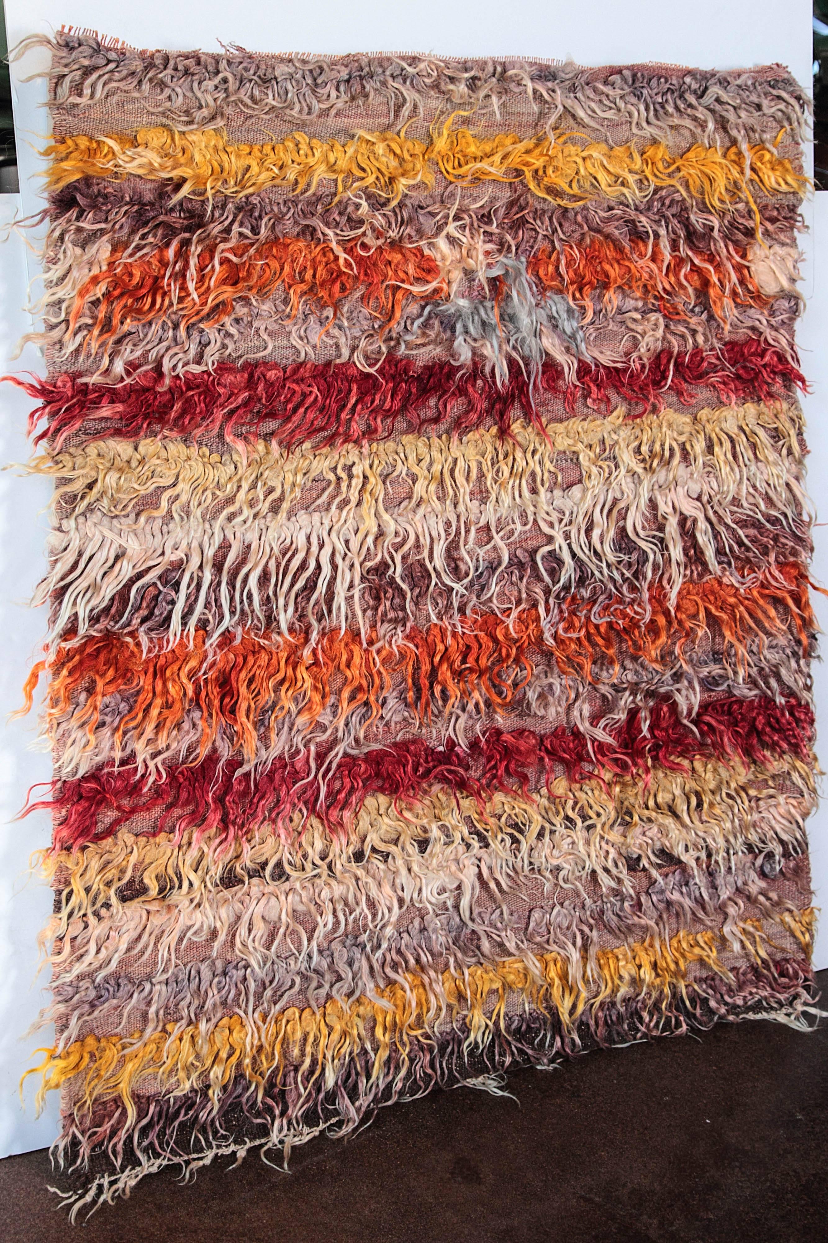 Tulu Shaggy rug portrait
Vintage vibrant color Turkish Tulu Shaggy rug with abstract design
Made from local Angora type goats` wool hand-knotted on a woollen Kilim.
Tulus are handwoven in central Turkey with extremely long angora wool