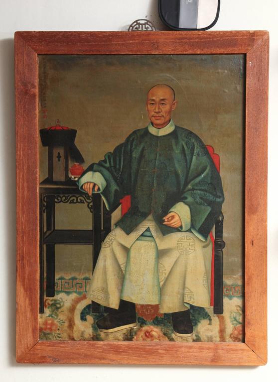 A Chinese 'Ancestor Portrait' oil on canvas laid down on board, depicting a seated dignitary. The Chinese characters identify the artist at Giuseppe Castiglione (1688-1766), a Jesuit priest. The sitter is identified as the 