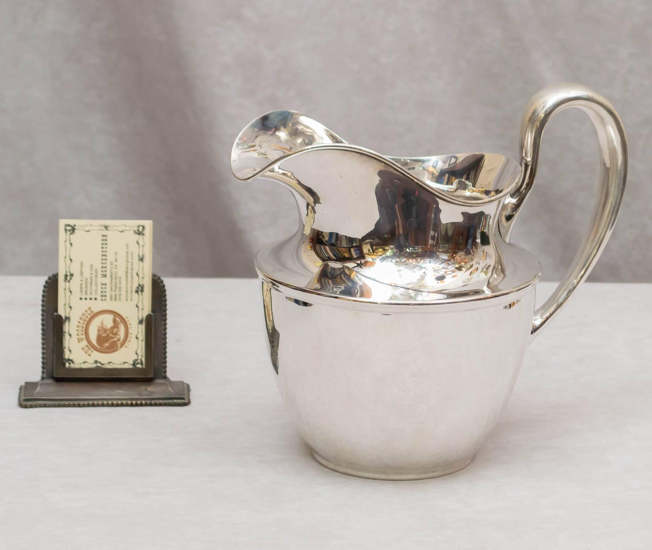 This lovely sterling silver pitcher would make a wonderful wedding gift for some deserving couple. It is marked as described above. Shreve & Co. San Francisco, Sterling, January 4, 1921, 41/2 pints. It weighs 21.03 troy ounces, and is in beautiful