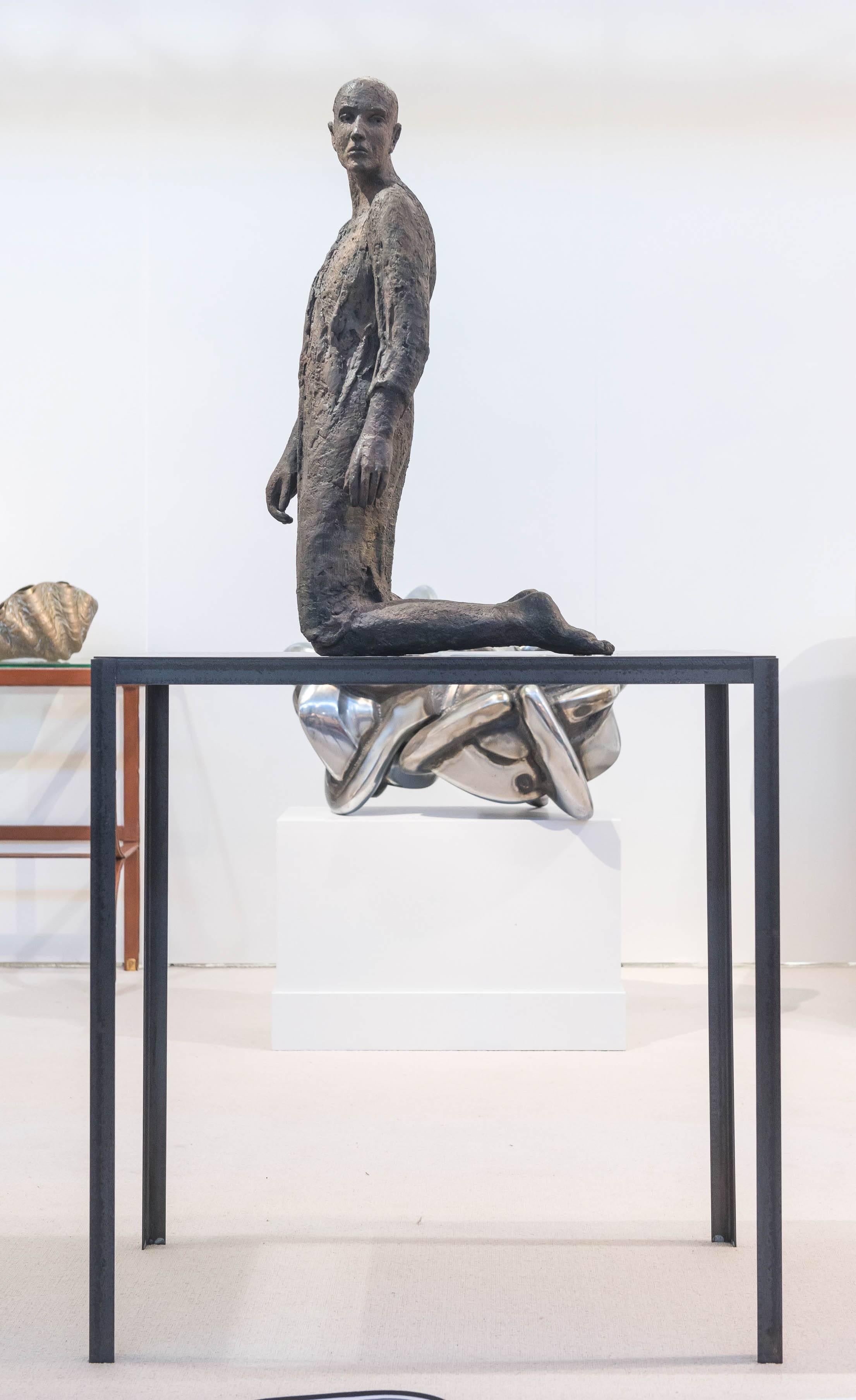 A remarkable, patinated bronze sculpture by Hanneke Beaumont (born 1947). 
"Melancholia I" from the Melancholia Series, signed H.B.
Executed in 1999 from an edition of 8.
Representing a kneeling meditative figure on a bronze