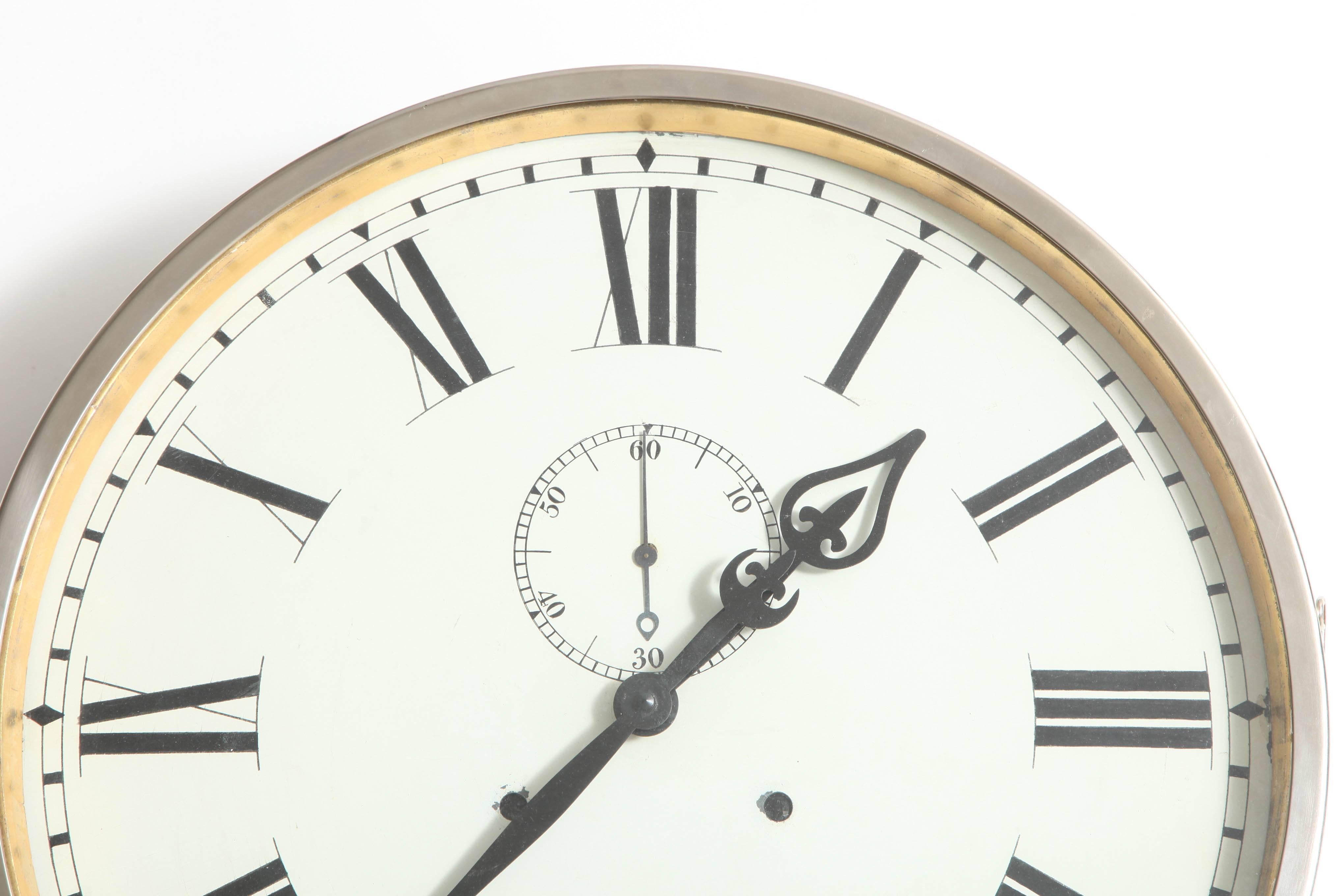 Industrial Steel clock from the 1930s made of steel with hand painted enamel roman numerals in the British Imperial style 