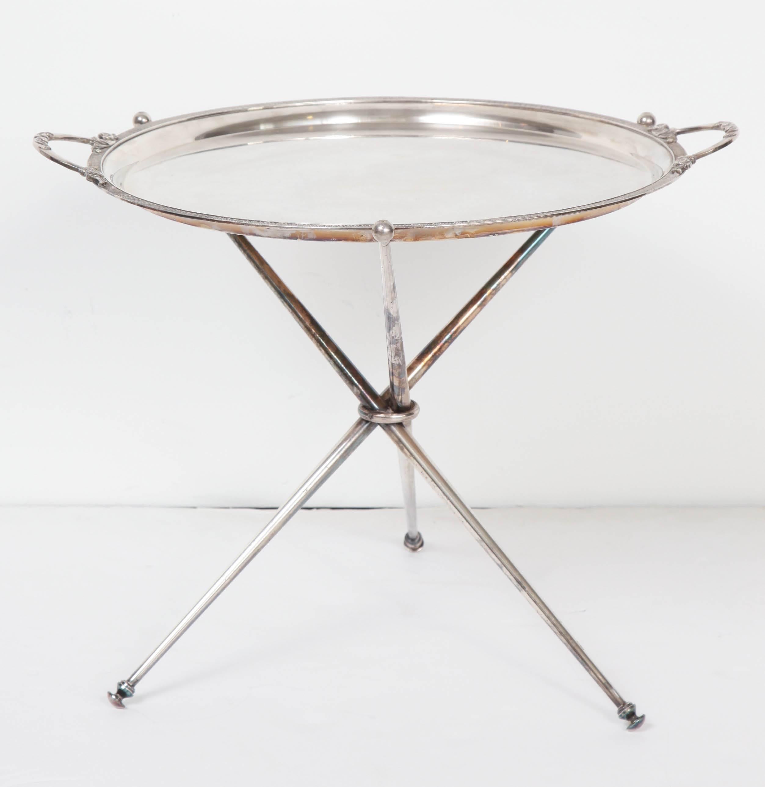 A chic little silver plate tray with handles on a stand--perfect for a cocktail or a cup of tea!