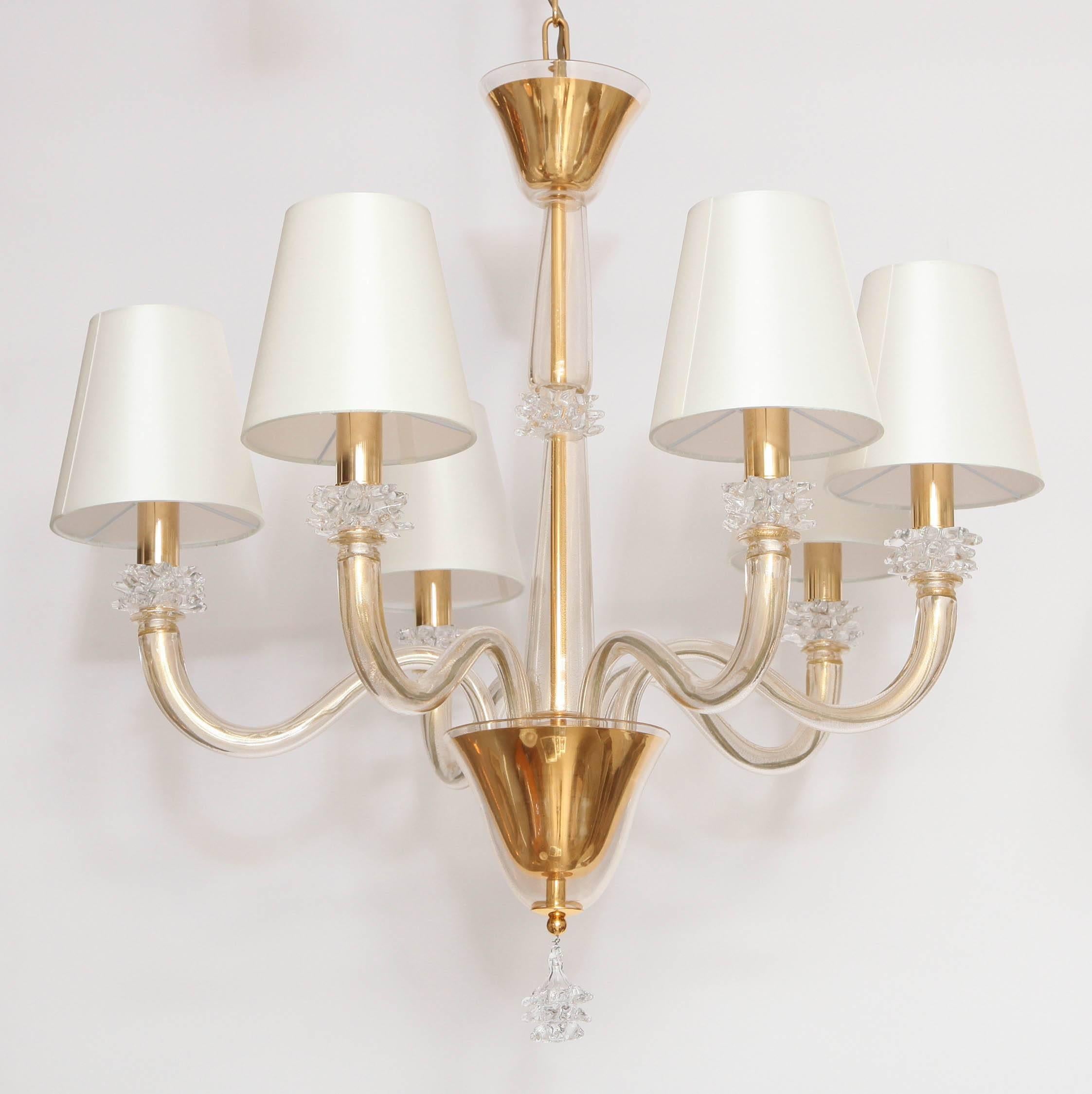 A charming, yet elegant six-arm Murano glass chandelier with gold leaf accents and lovely glass flower bobeches on each arm and at base.
