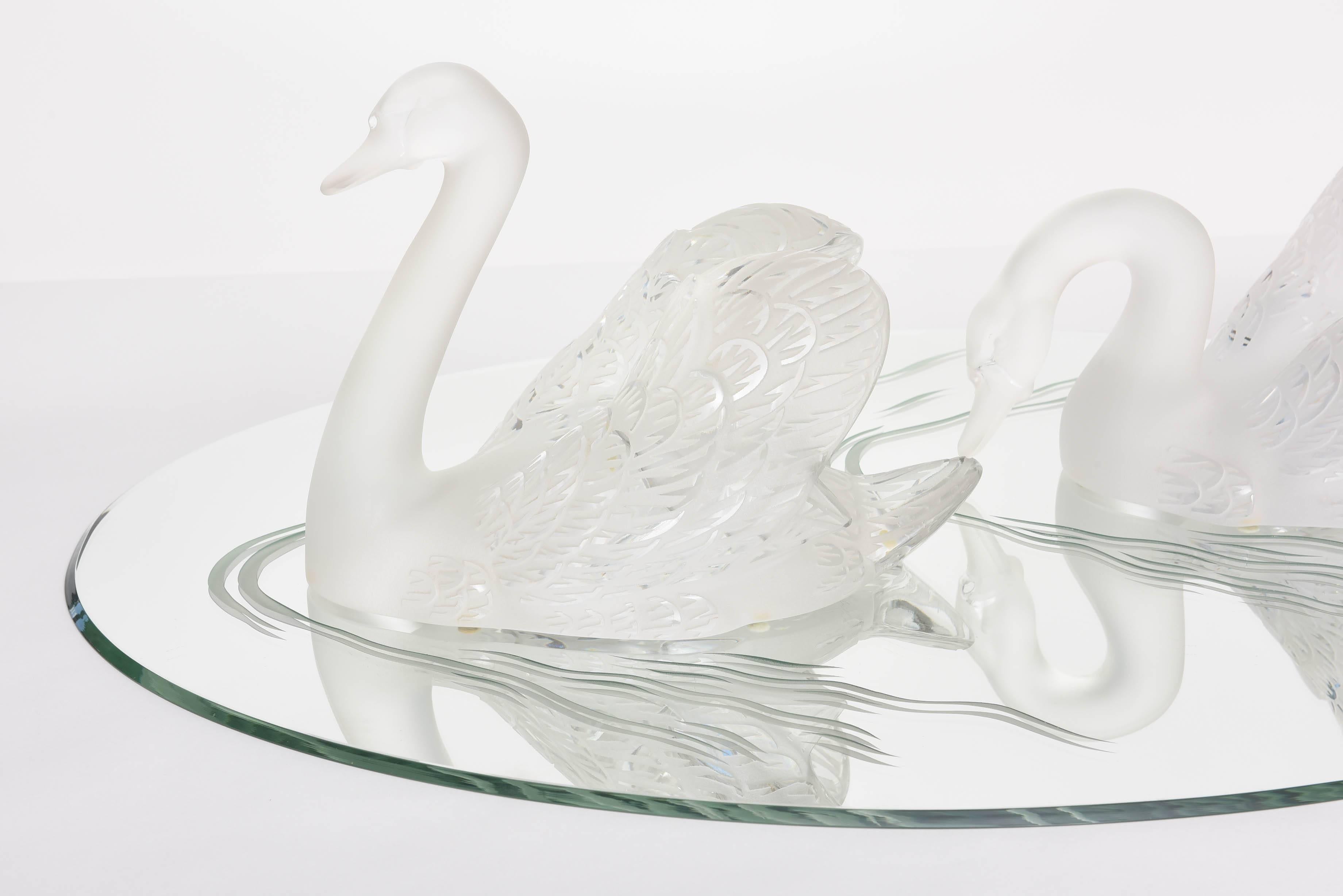 Graceful and stunning pair of Lalique Swans on their original etched plateau.
Head up: 13