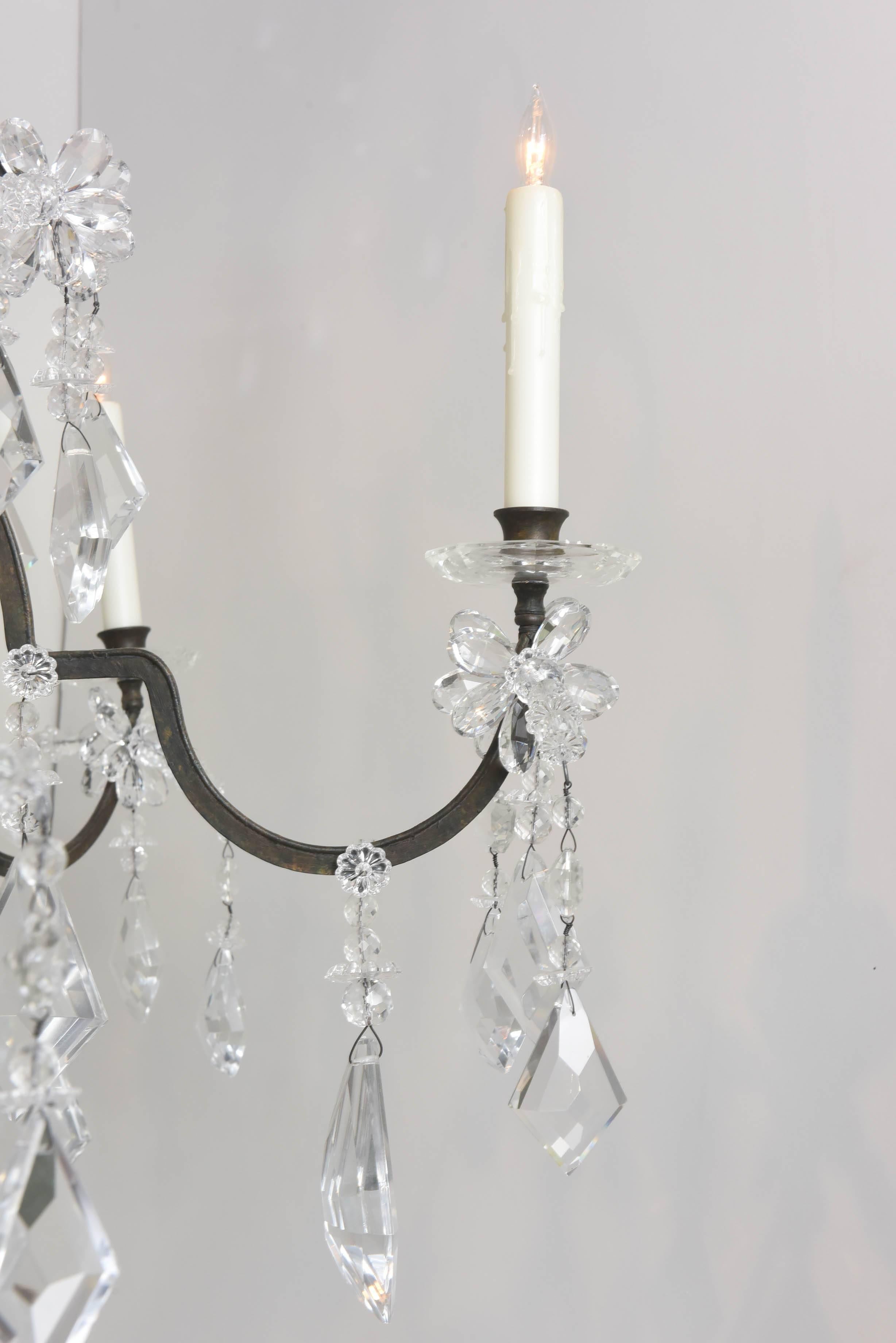 Stunning crystal chandelier with wrought iron frame in the Bagues style.